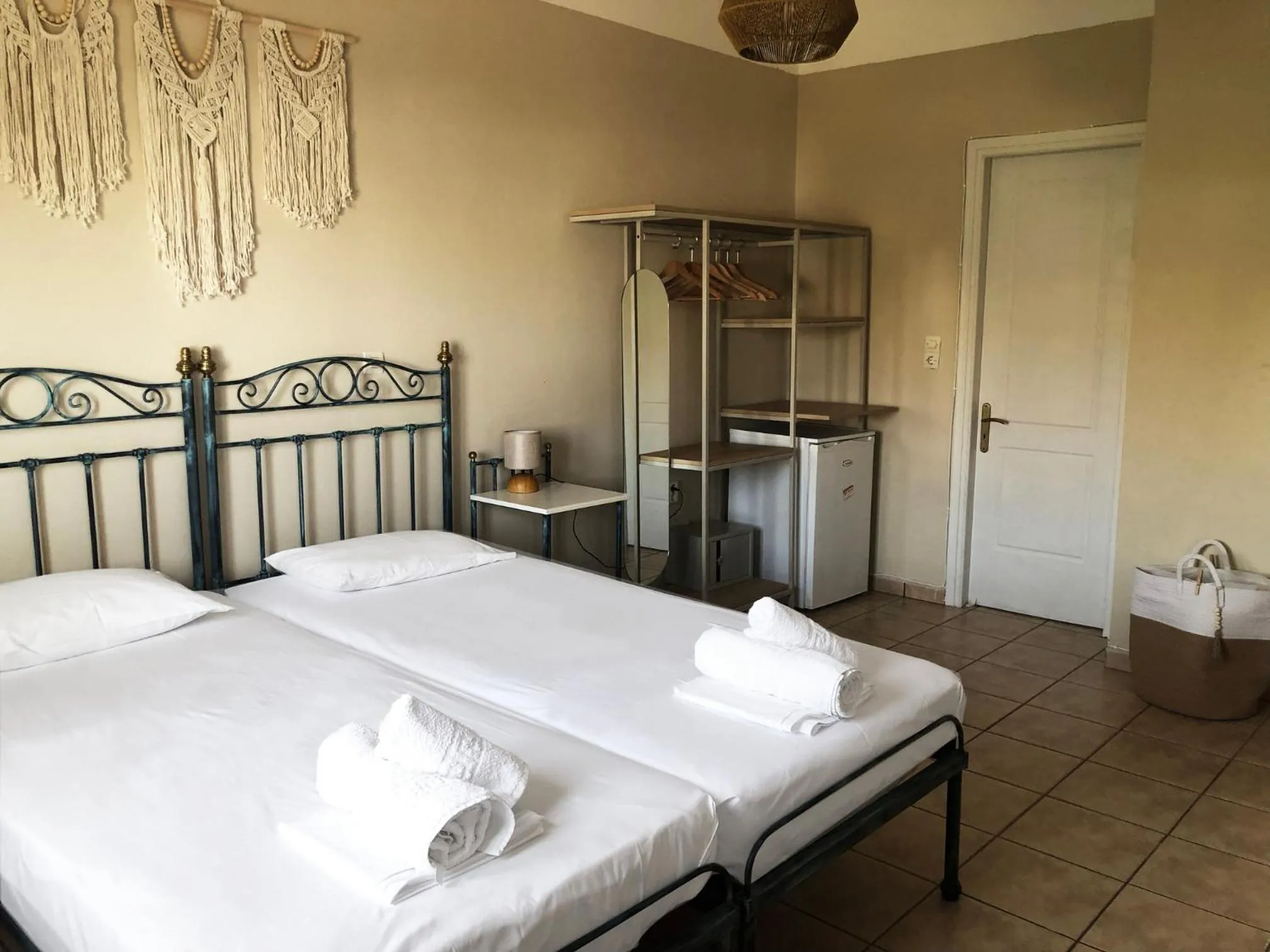 Bed in Agnadi Syros Beachfront Studios & Rooms
