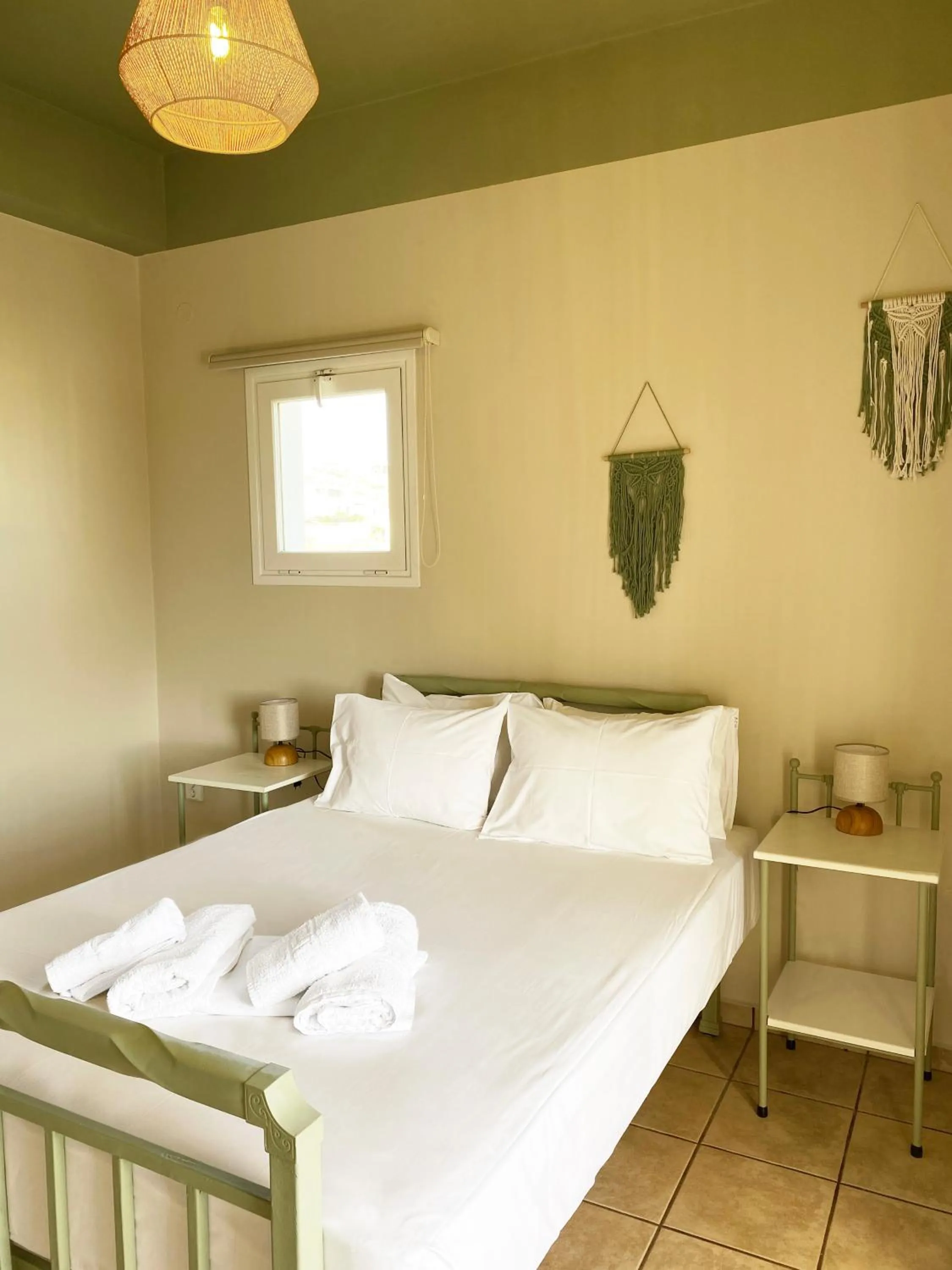 Bed in Agnadi Syros Beachfront Studios & Rooms