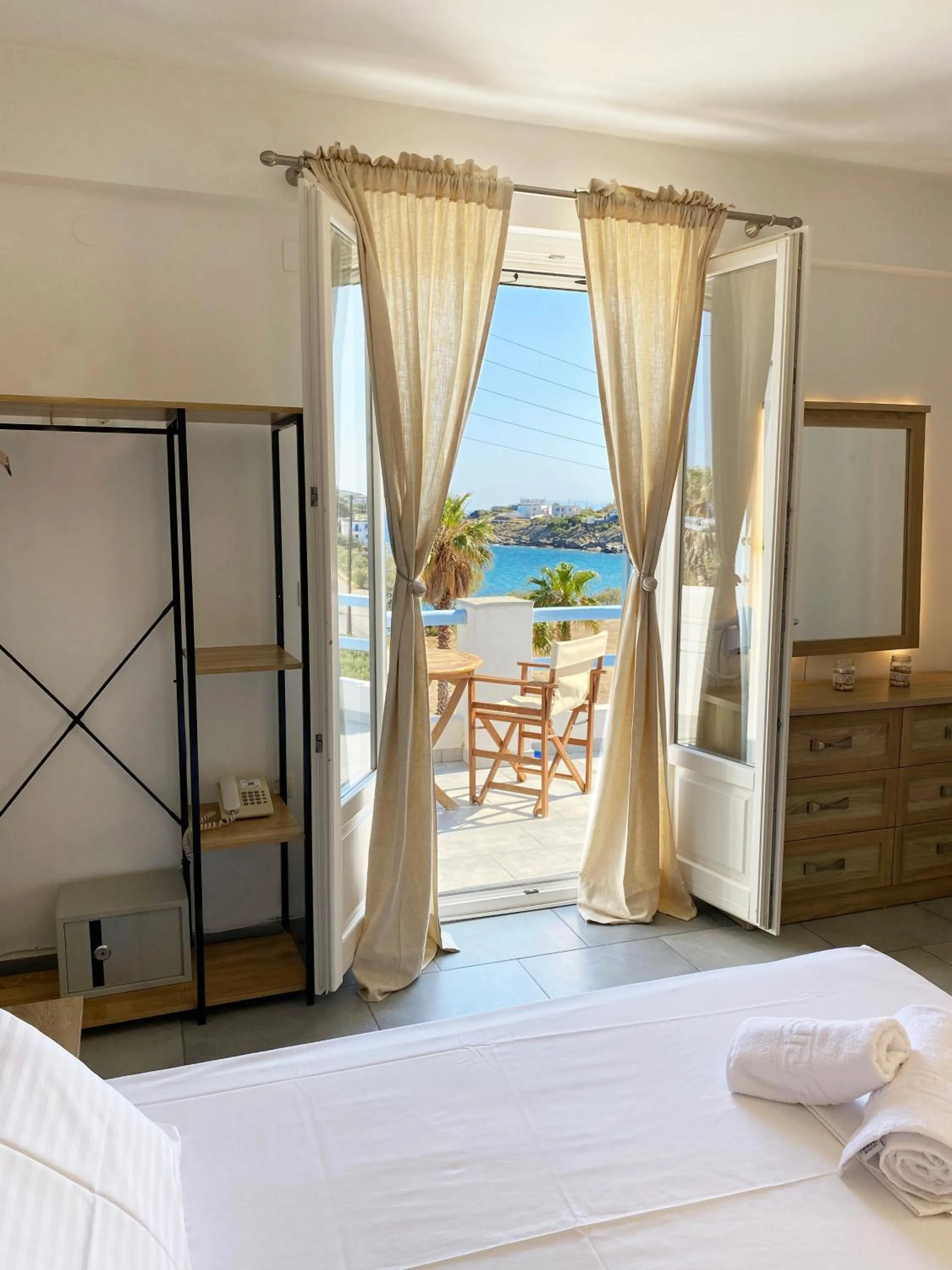 Bed in Agnadi Syros Beachfront Studios & Rooms