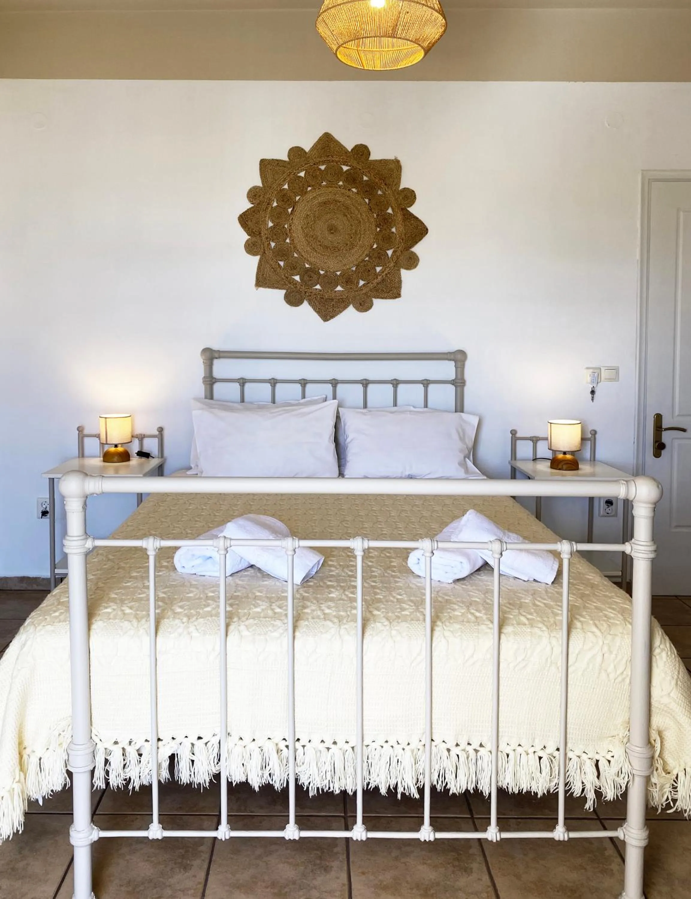 Bed in Agnadi Syros Beachfront Studios & Rooms