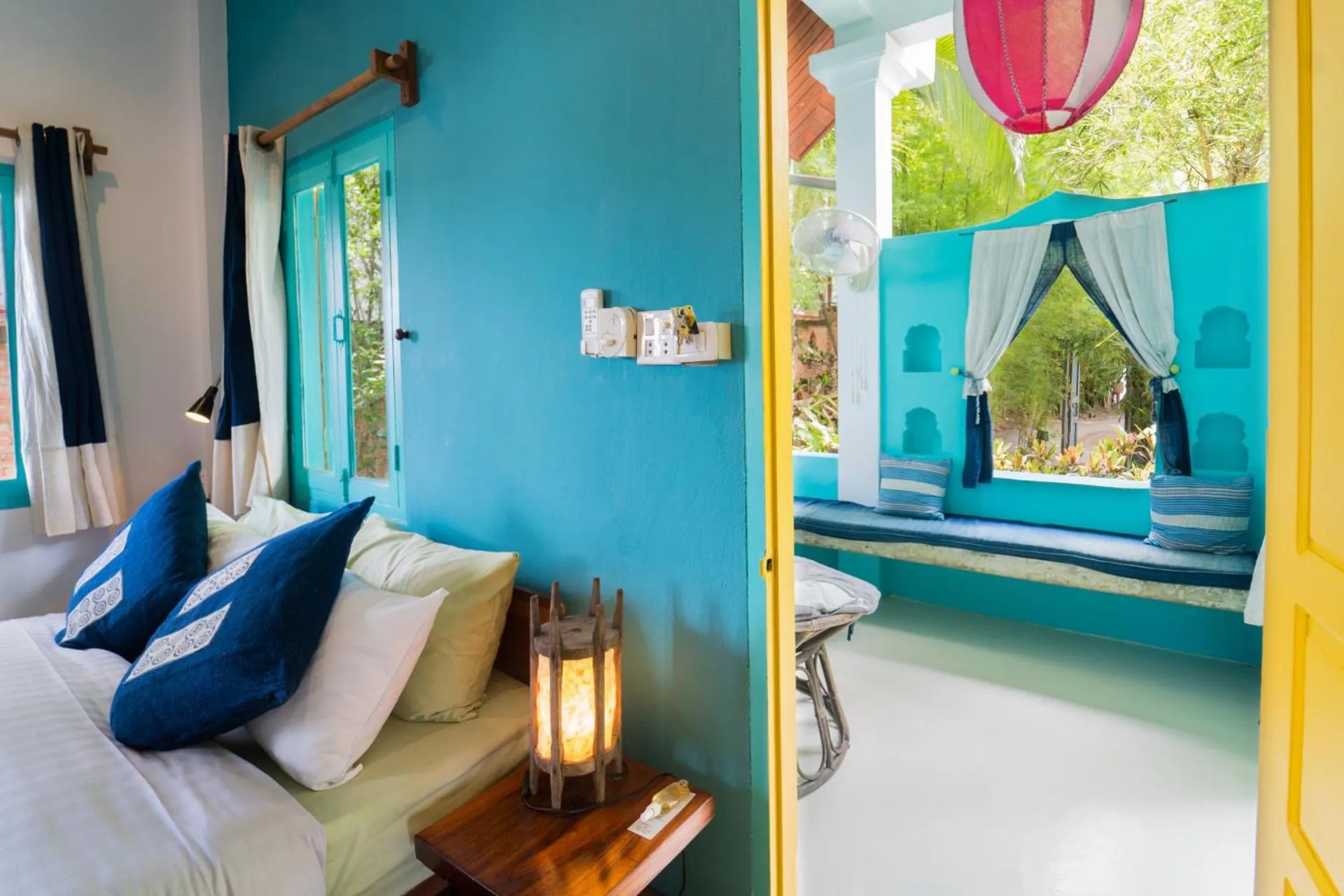 Seating area, Bed in Ock Pop Tok Mekong Villa