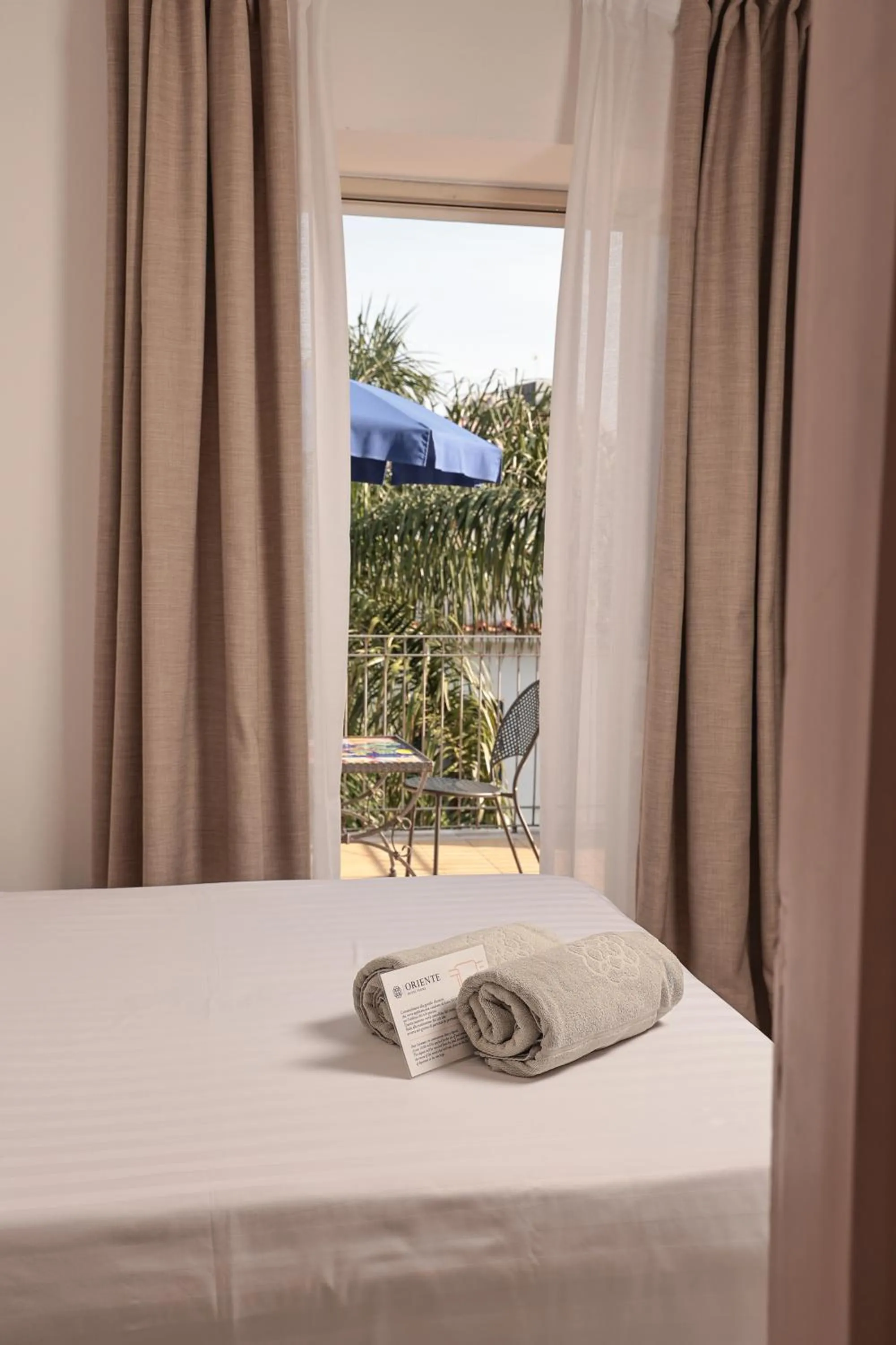 Balcony/Terrace, Bed in Hotel Terme Oriente - Beach & SPA
