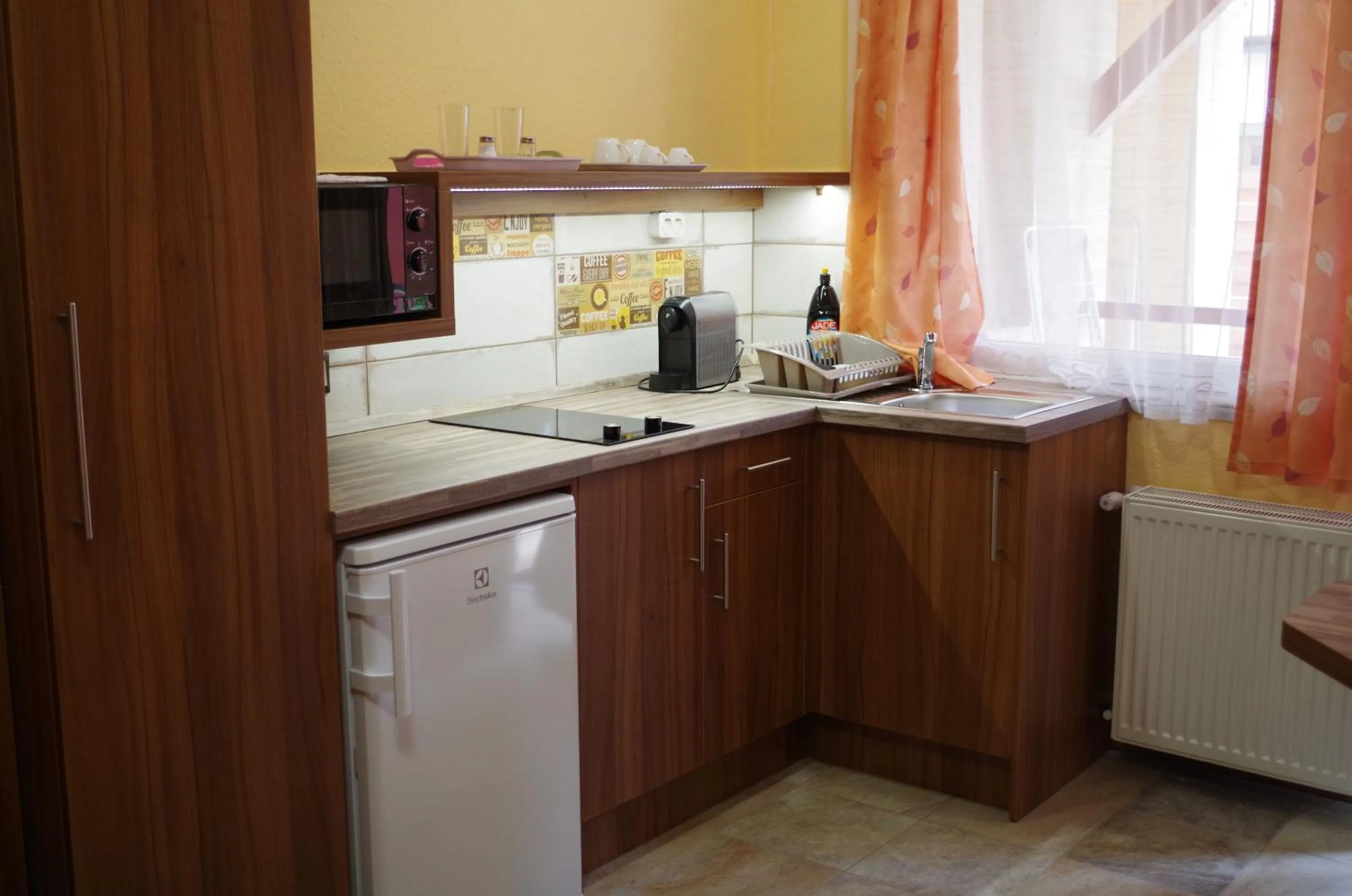 Kitchen or kitchenette in Aranyhal Apartman