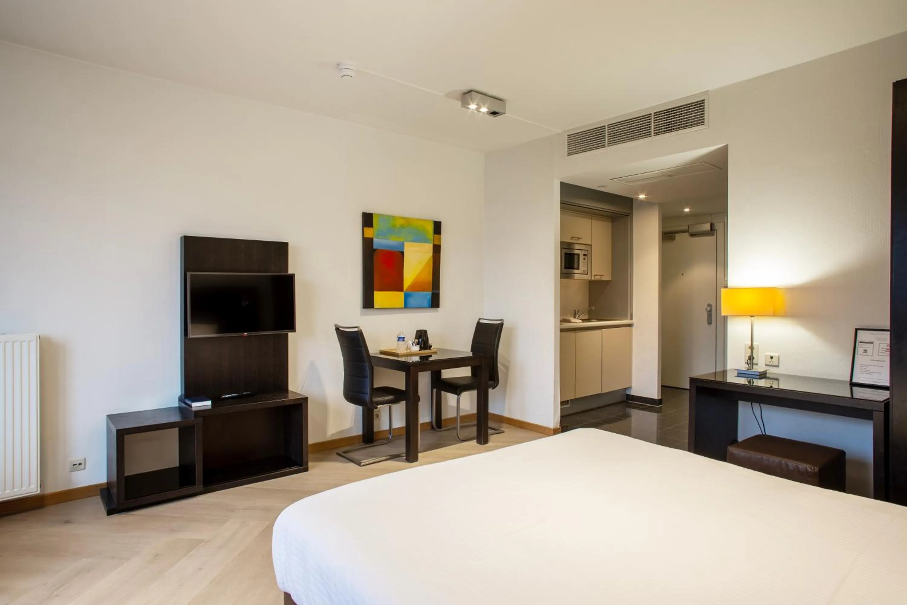 Seating area, Bed in Diamant Suites Brussels EU