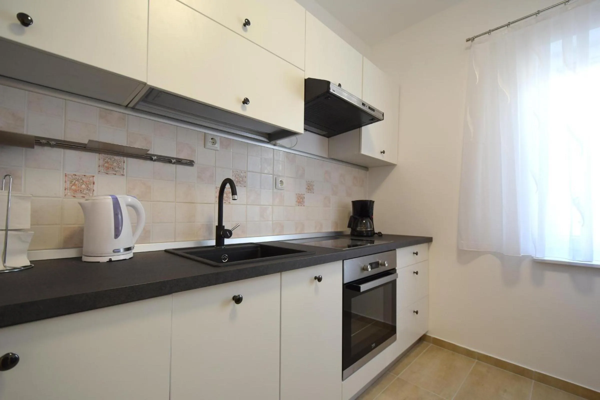 Kitchen or kitchenette in Apartments Buturajac