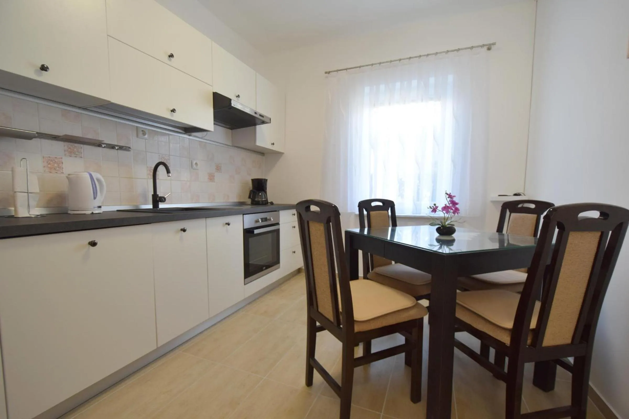 Kitchen or kitchenette in Apartments Buturajac
