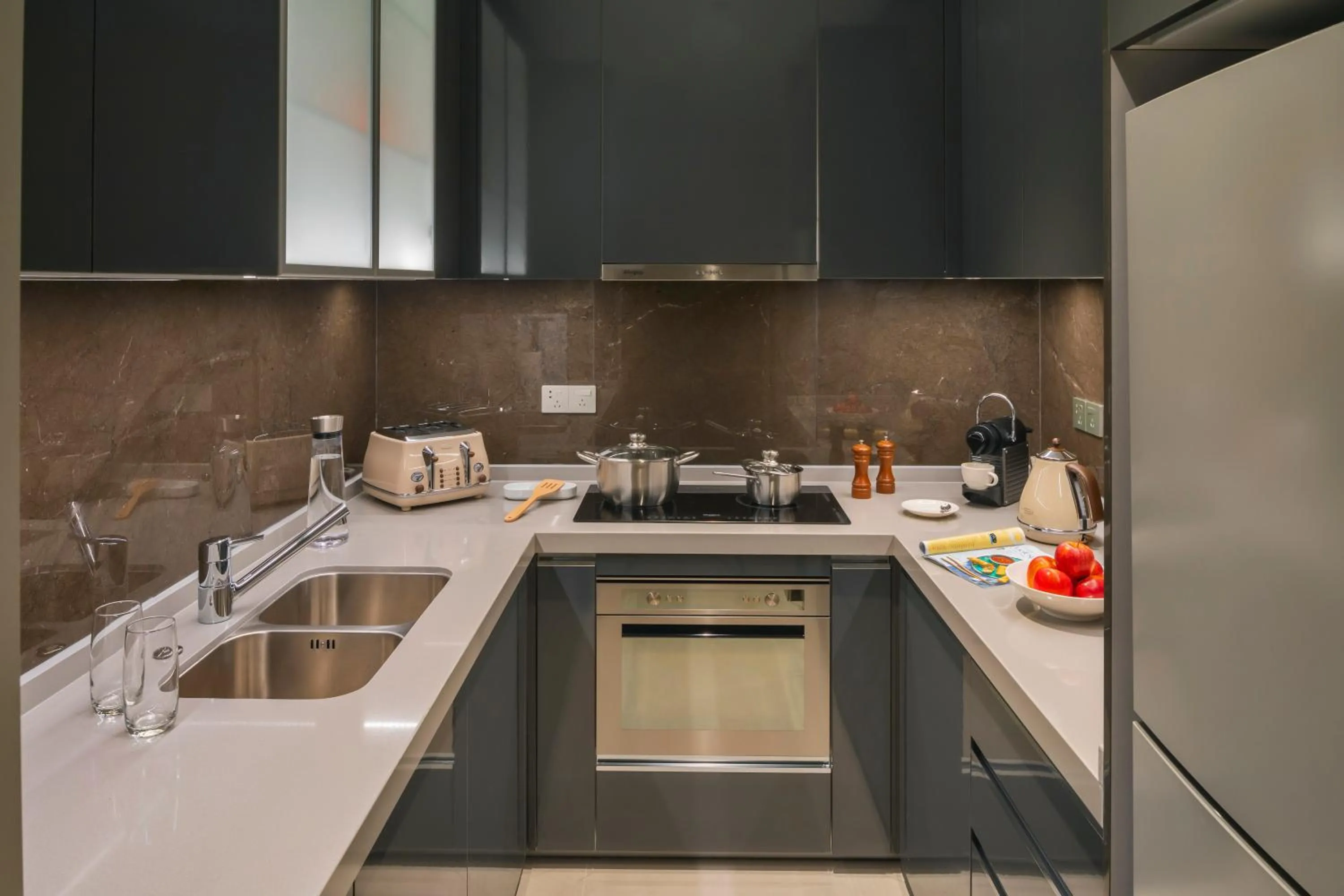 Kitchen or kitchenette in Oakwood Apartments Sanya