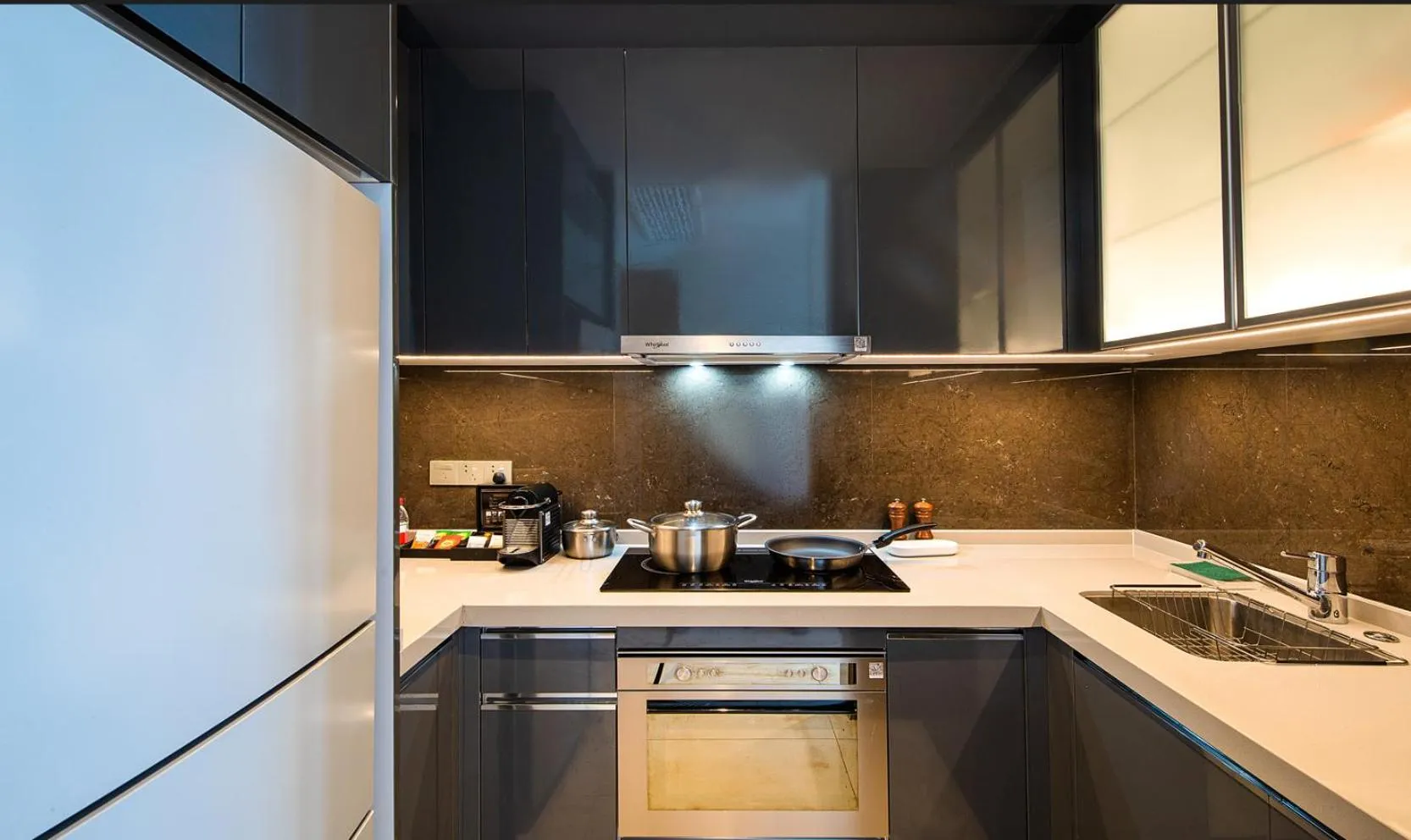 Kitchen or kitchenette in Oakwood Apartments Sanya