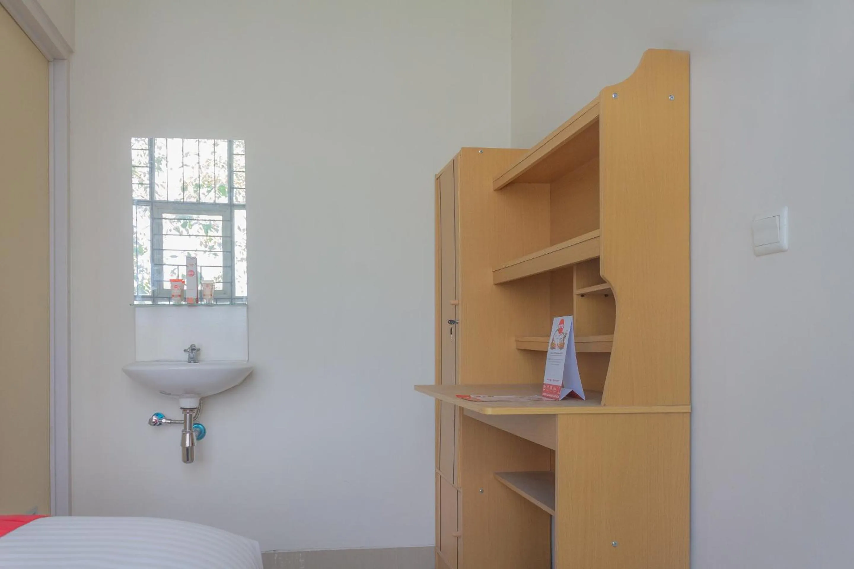 Bedroom in Hotel O 77 Guesthouse