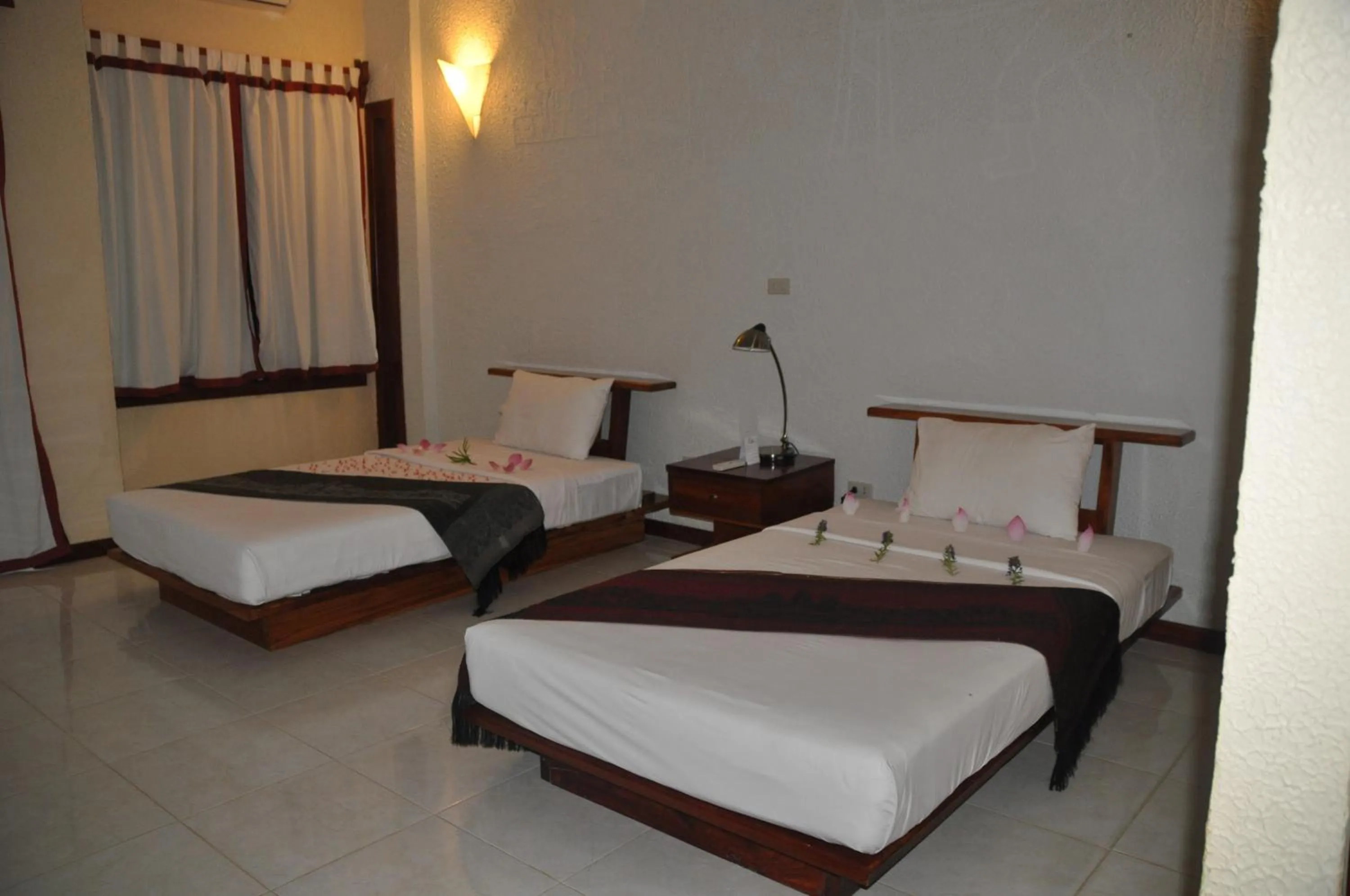 Bed in Memoria Palace & Resort