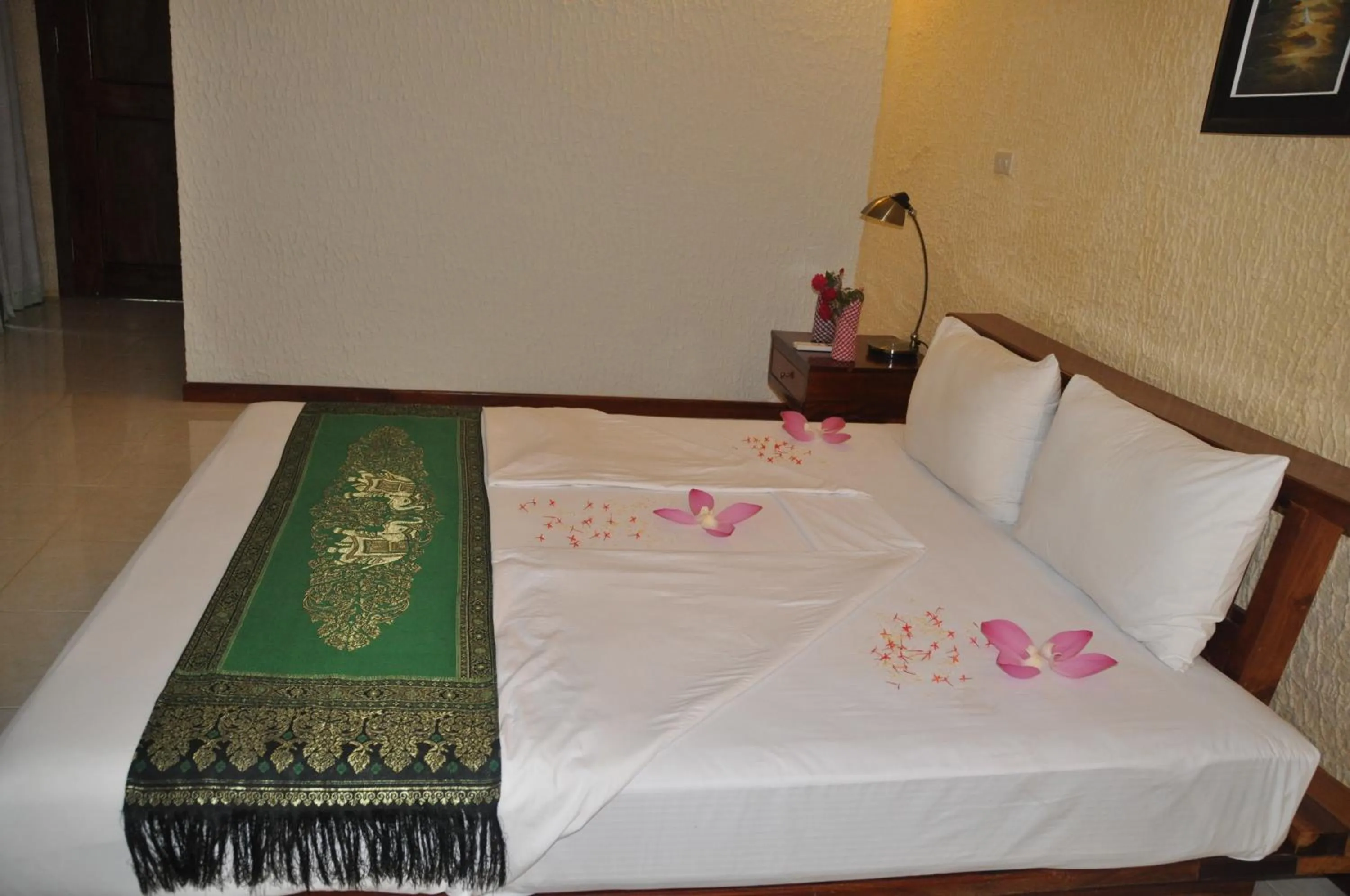 Bed in Memoria Palace & Resort