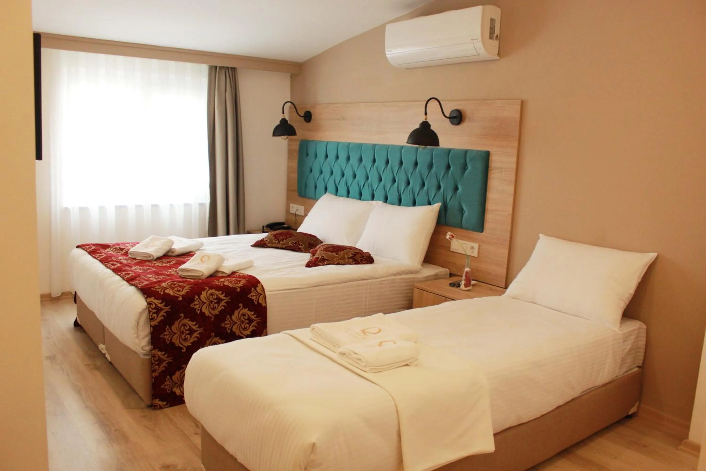 Bed in THE LAİLA HOTEL
