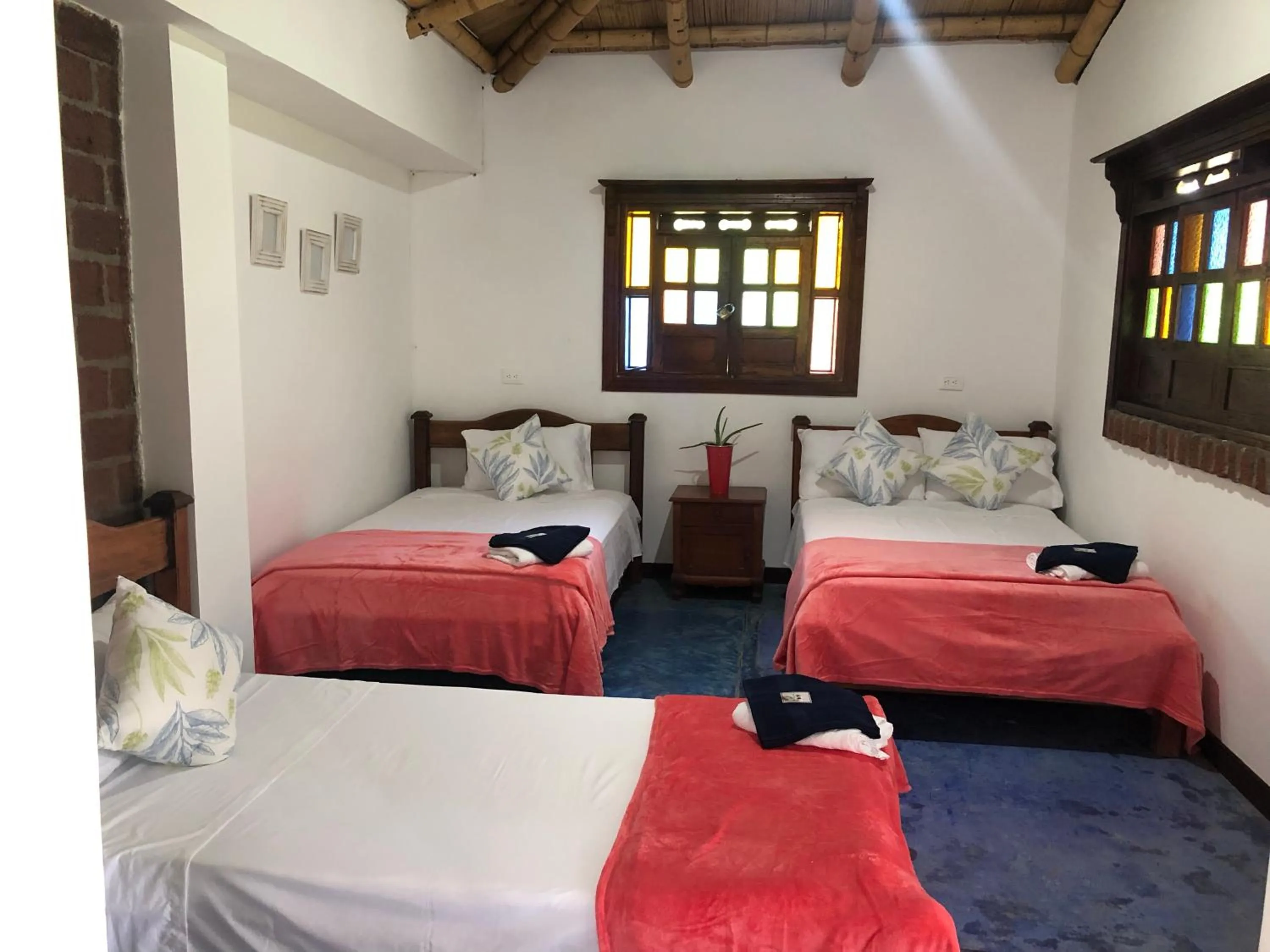 Bed in Finca Hotel Brasilia