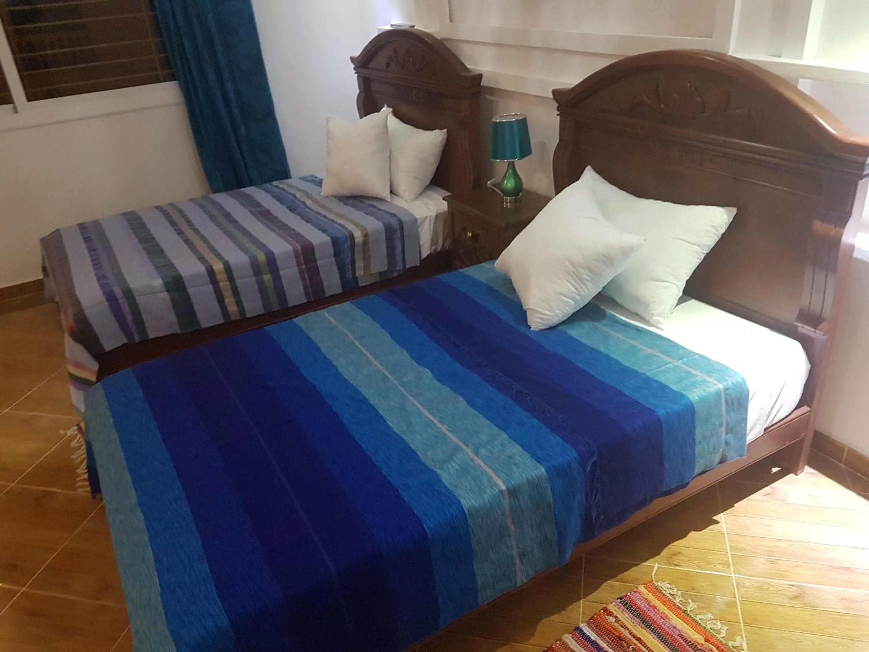 Bed in TANJITAN HOSPITALITE