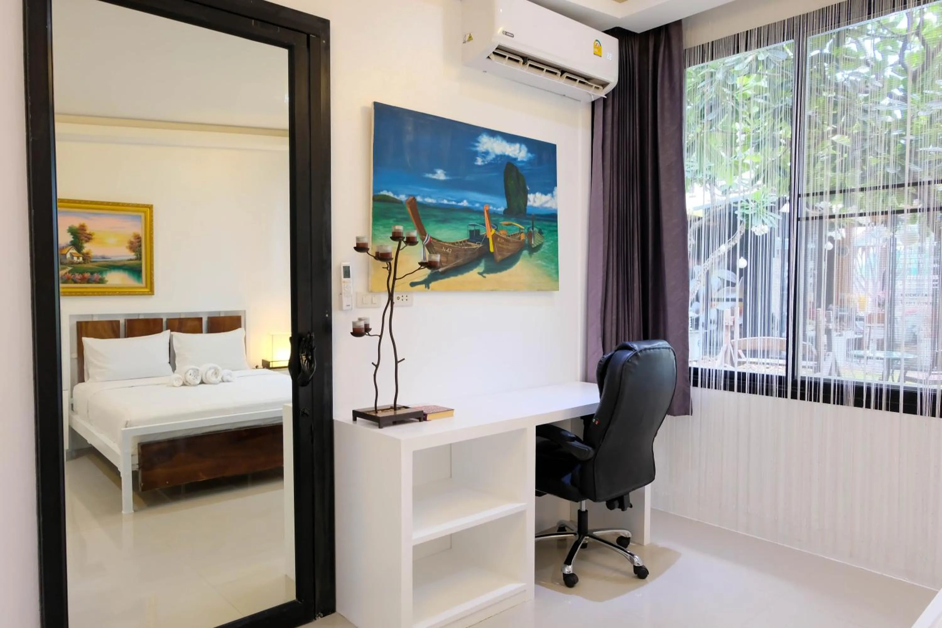 Seating area, Bed in Baan Poon Garden