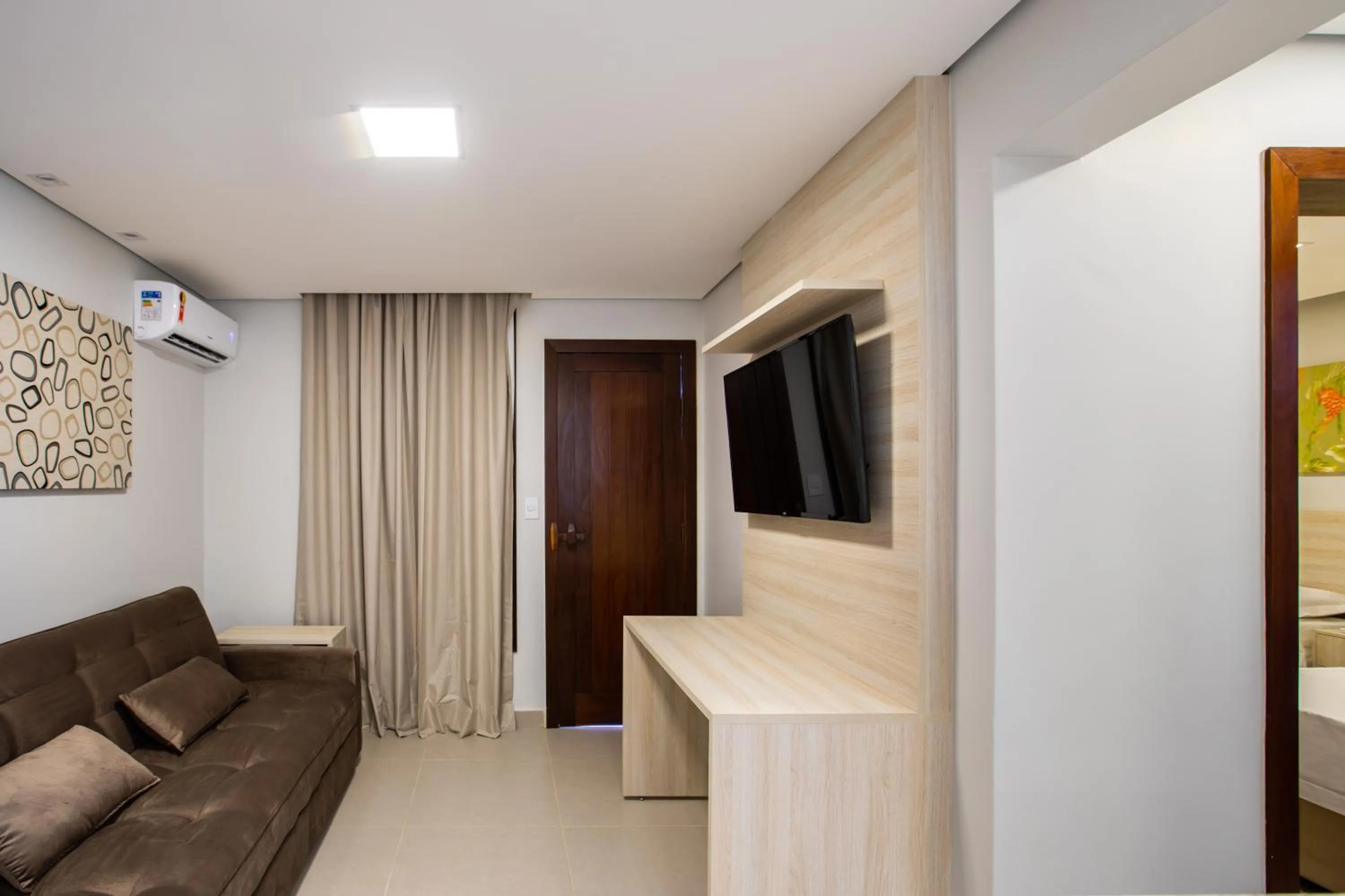 Living room in Hotel Encantos de Itaperapuã