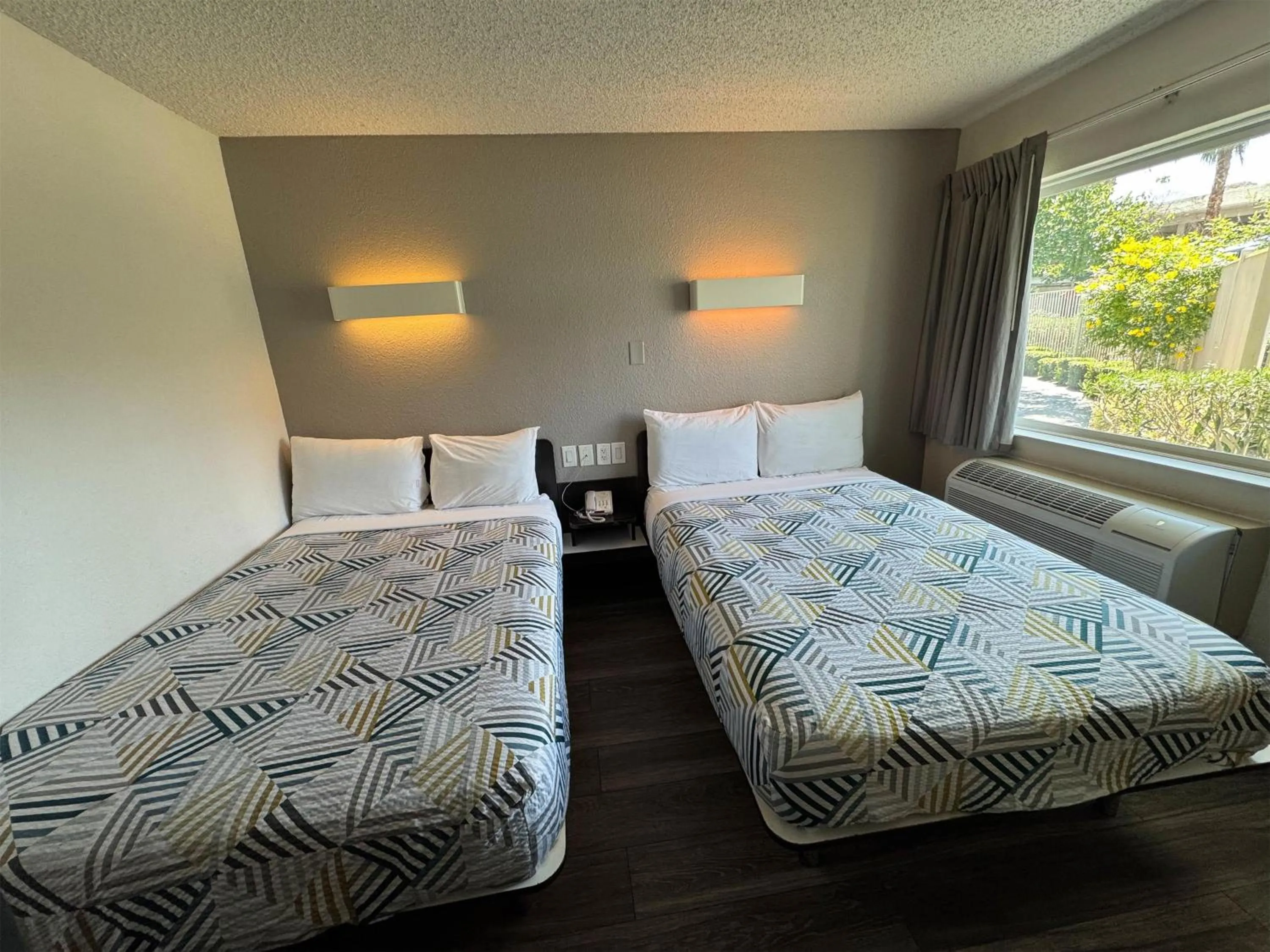 Photo of the whole room, Bed in Studio 6 Suites Las Vegas, NV - Tropicana