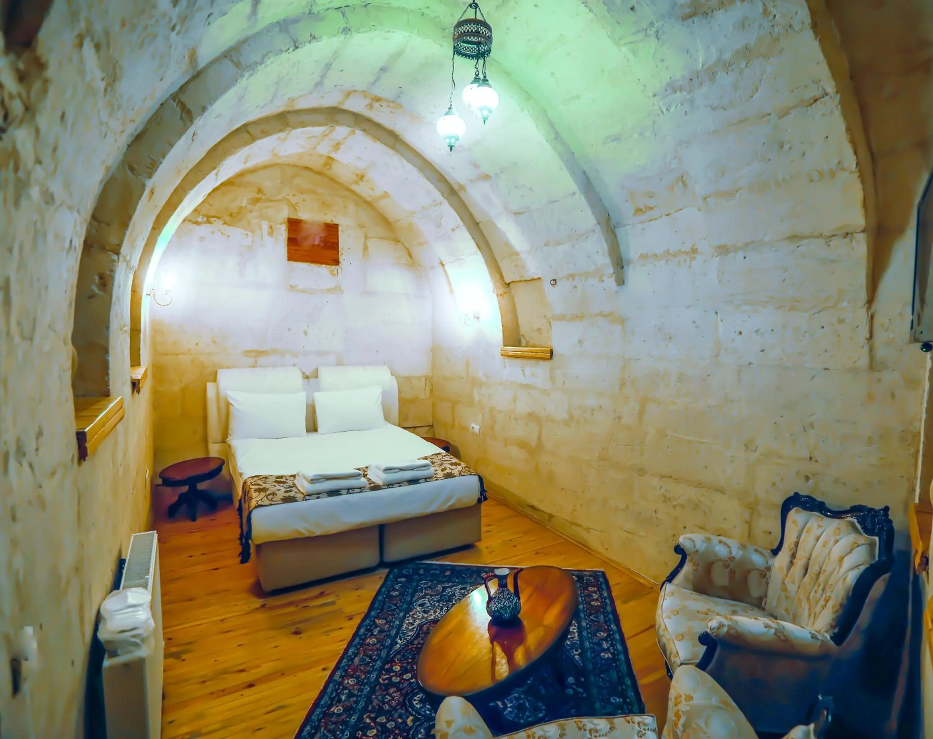 Bed in Larissa Cave Hotel