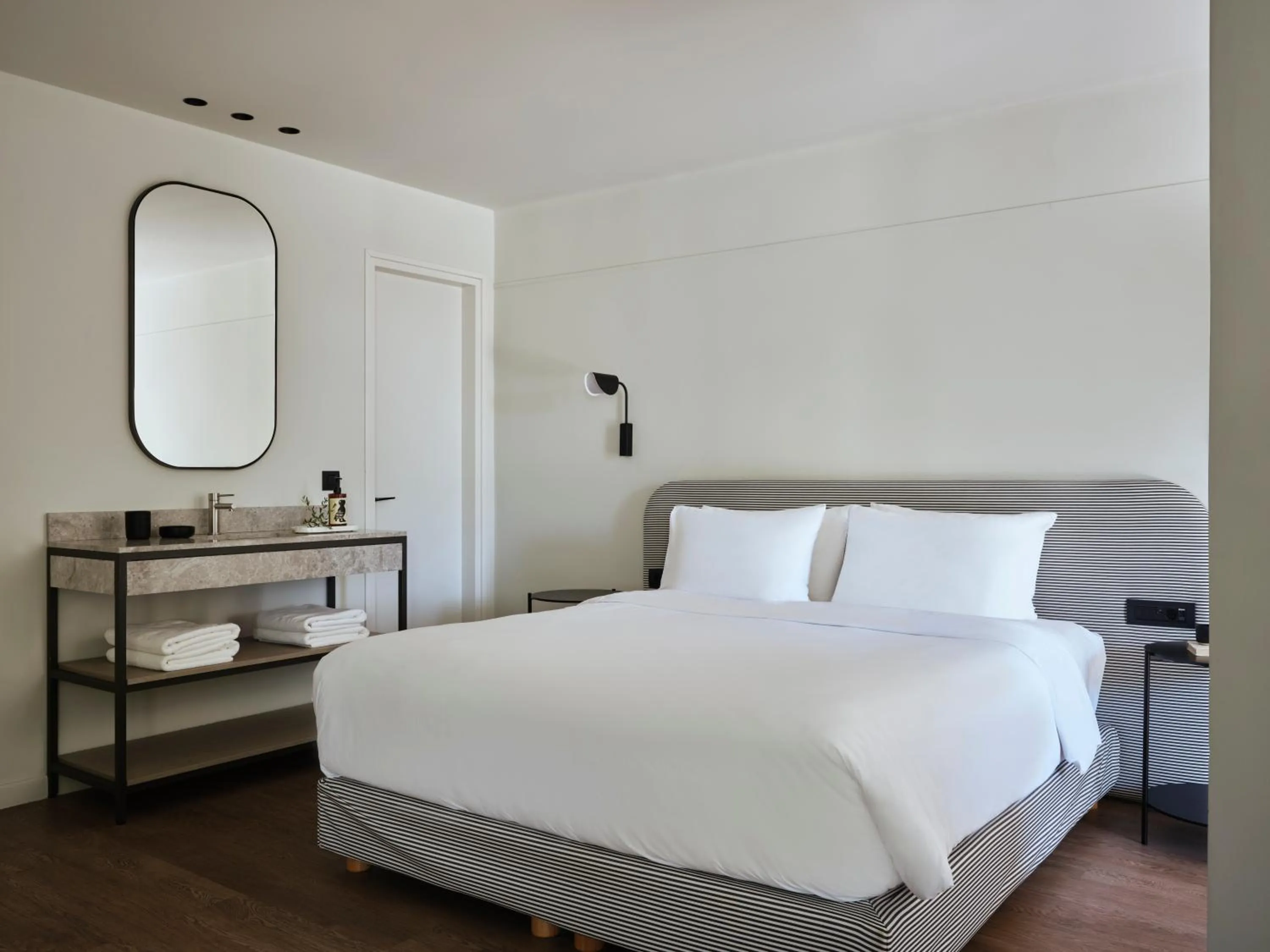 Photo of the whole room, Bed in Doryssa Lithos Hotel