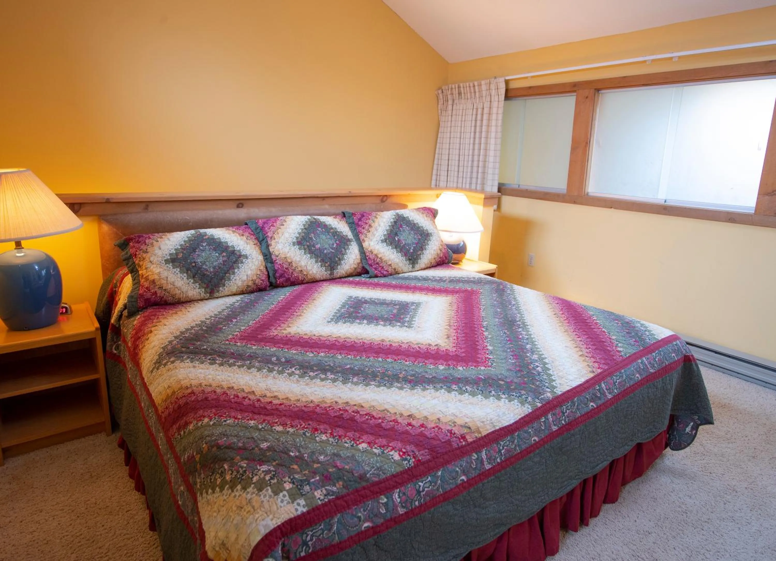 Bed in Okemo Mountain Lodging