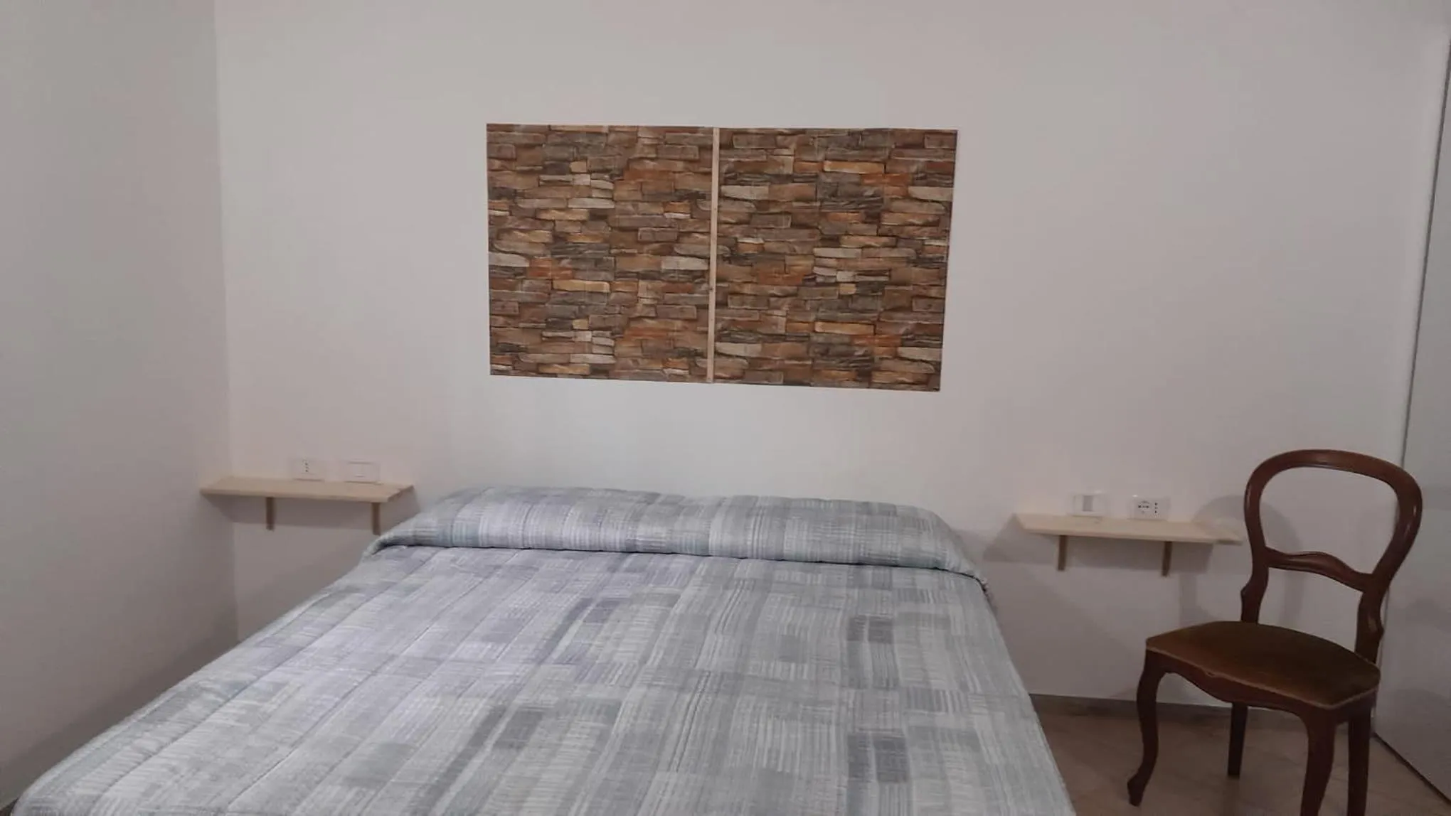 Bed in BeaStella Holiday Rooms