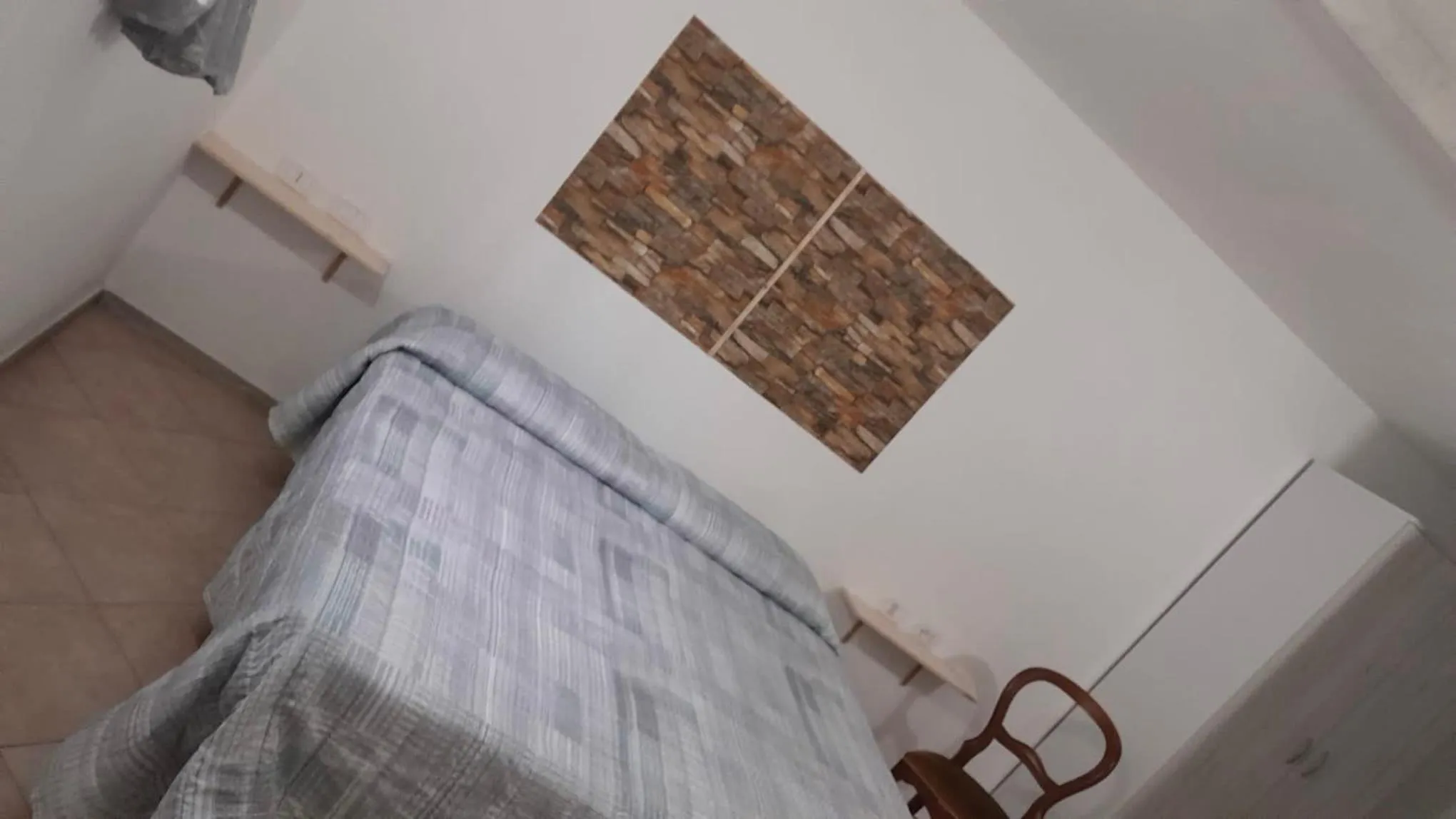 Bed in BeaStella Holiday Rooms