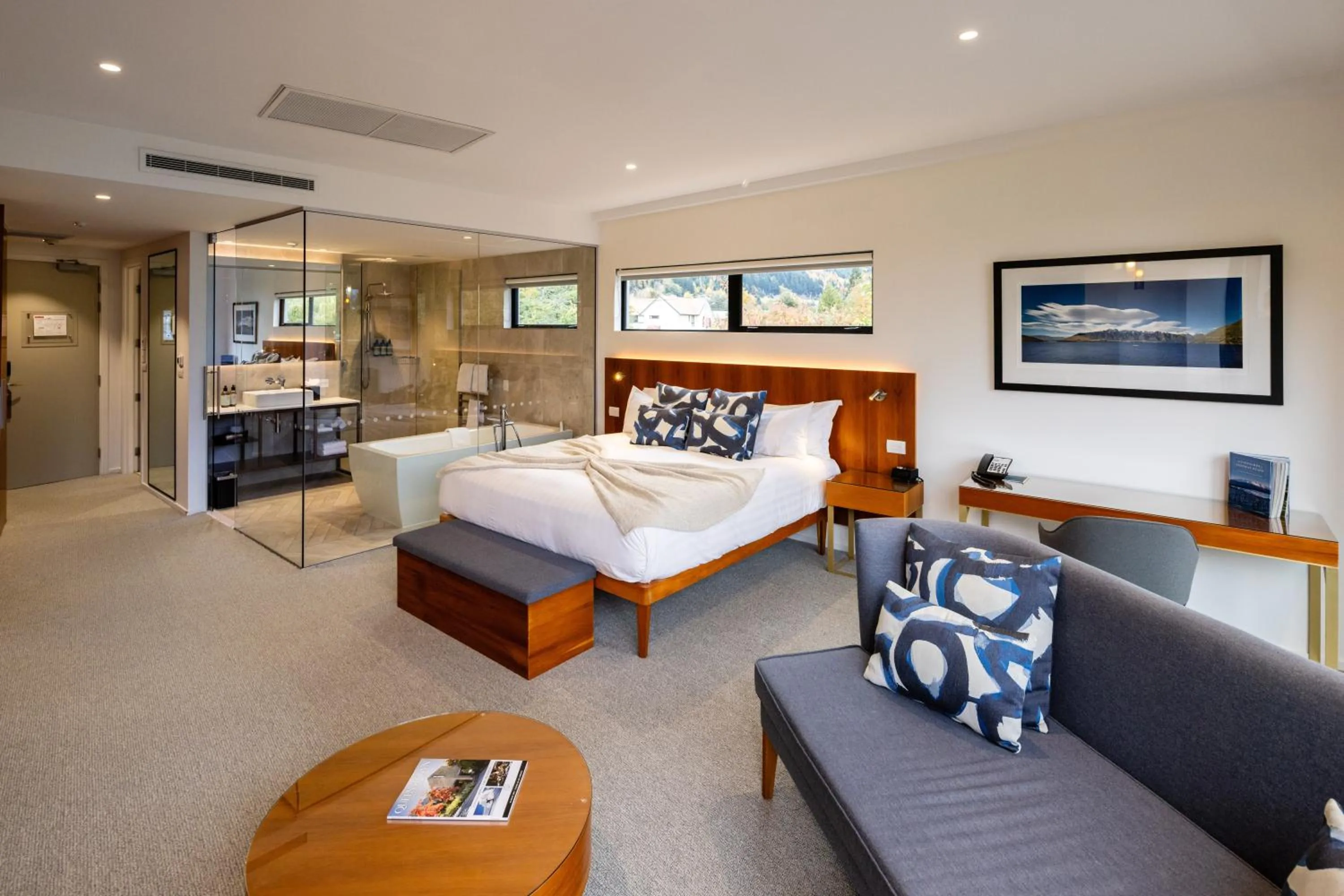 Seating area, Bed in Queenstown Park Boutique Hotel