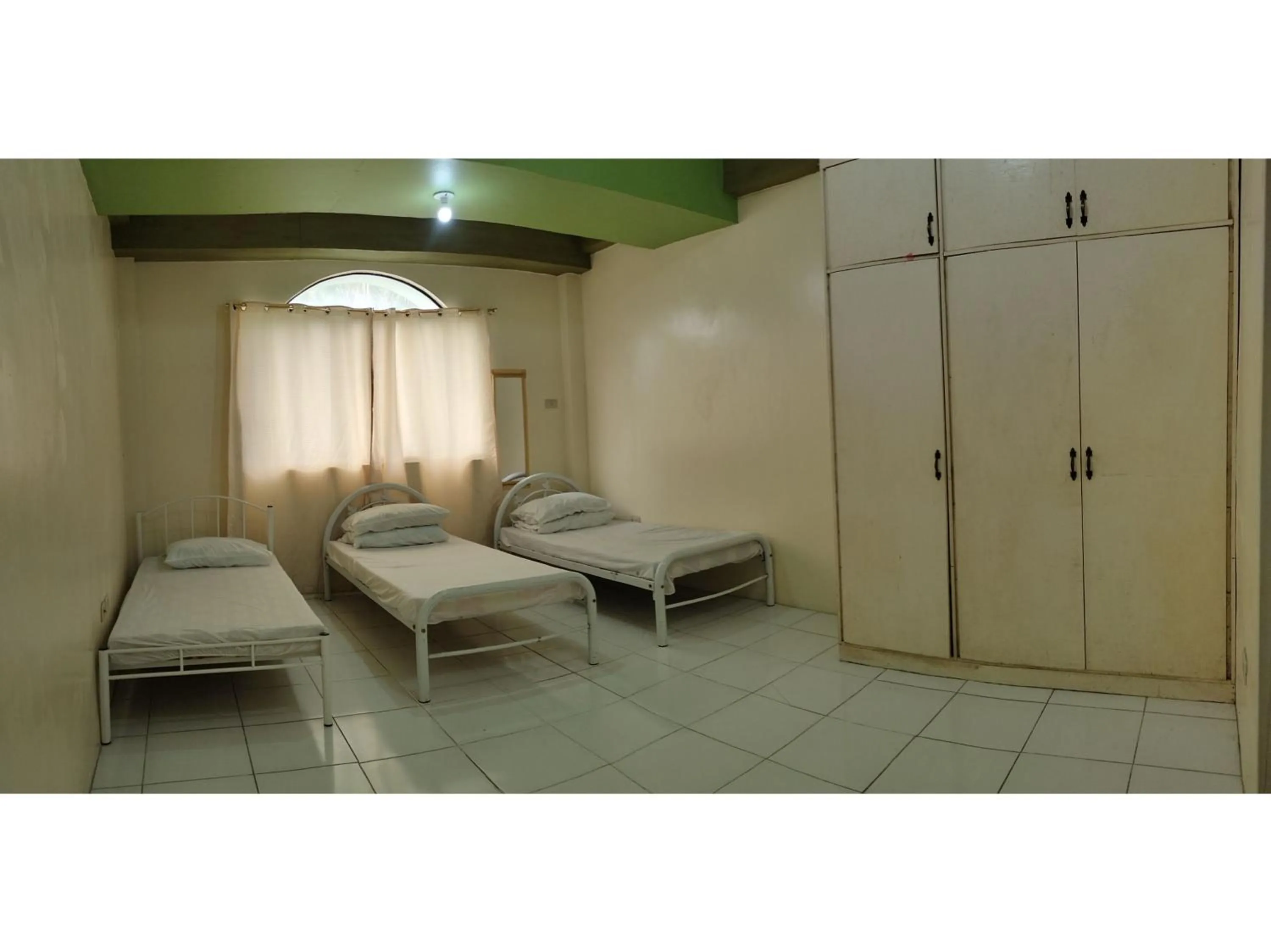 Standard Triple in OYO 800 Ddd Habitat Dormtel Bacolod