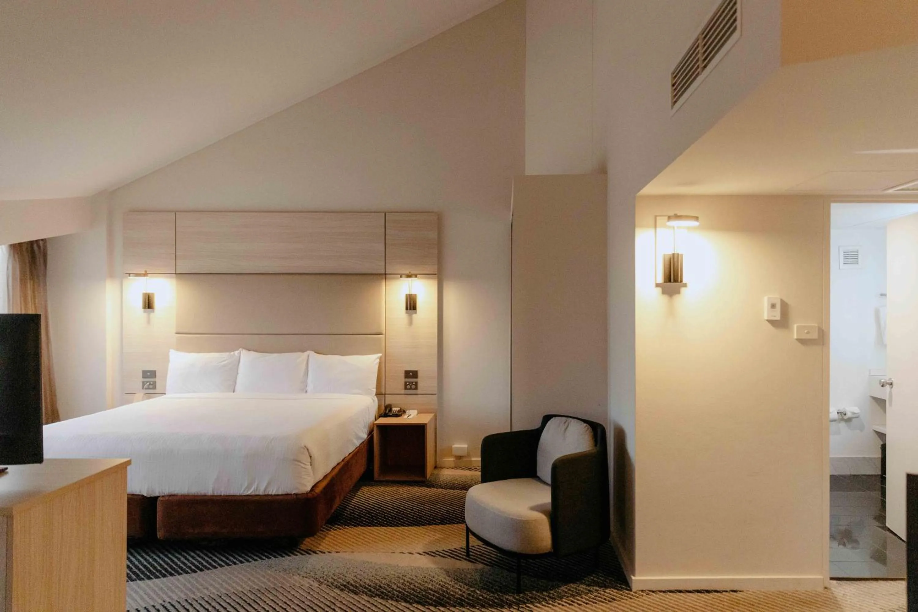 Bed in Novotel Sydney Parramatta