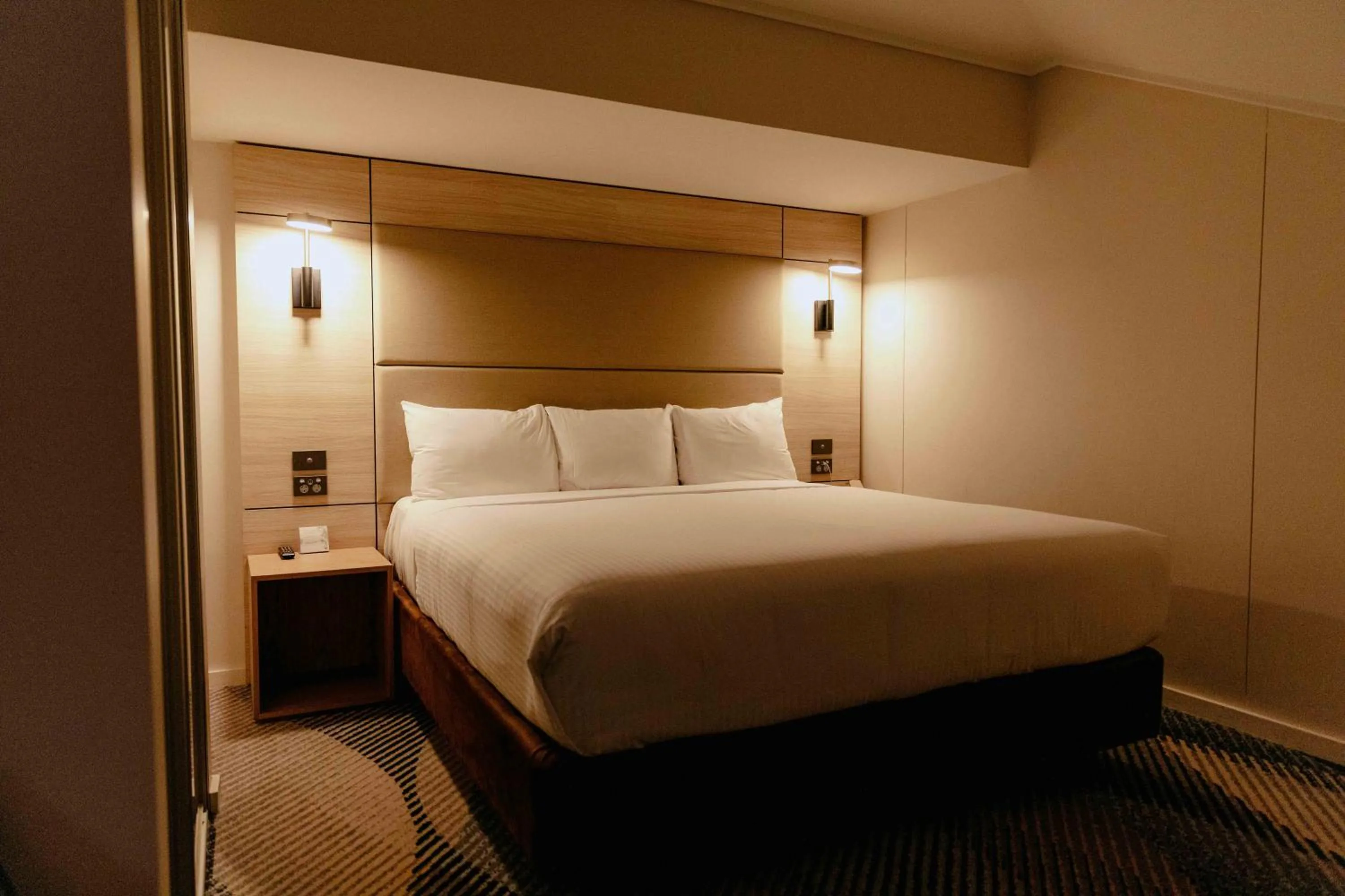 Bed in Novotel Sydney Parramatta