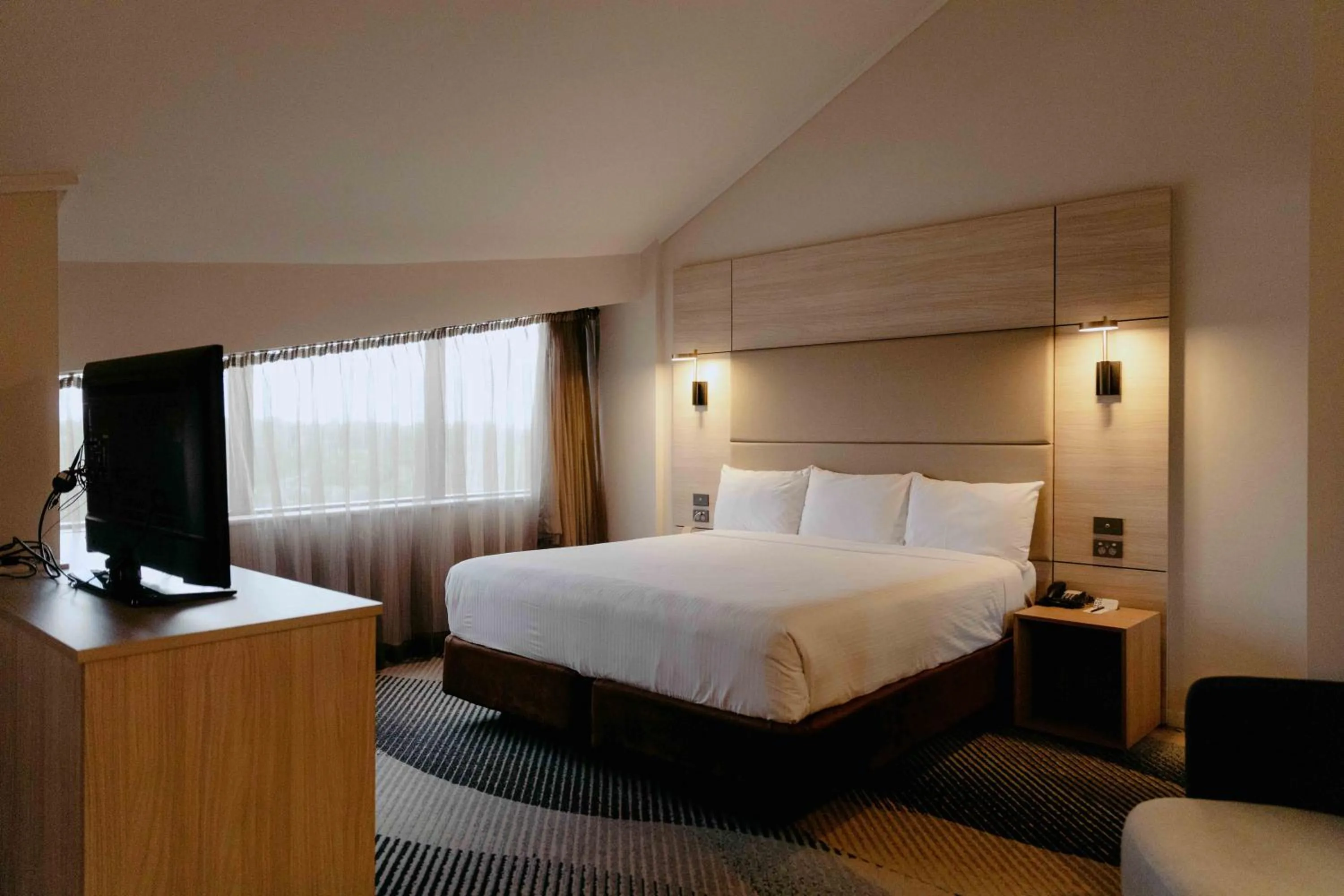 Bed in Novotel Sydney Parramatta