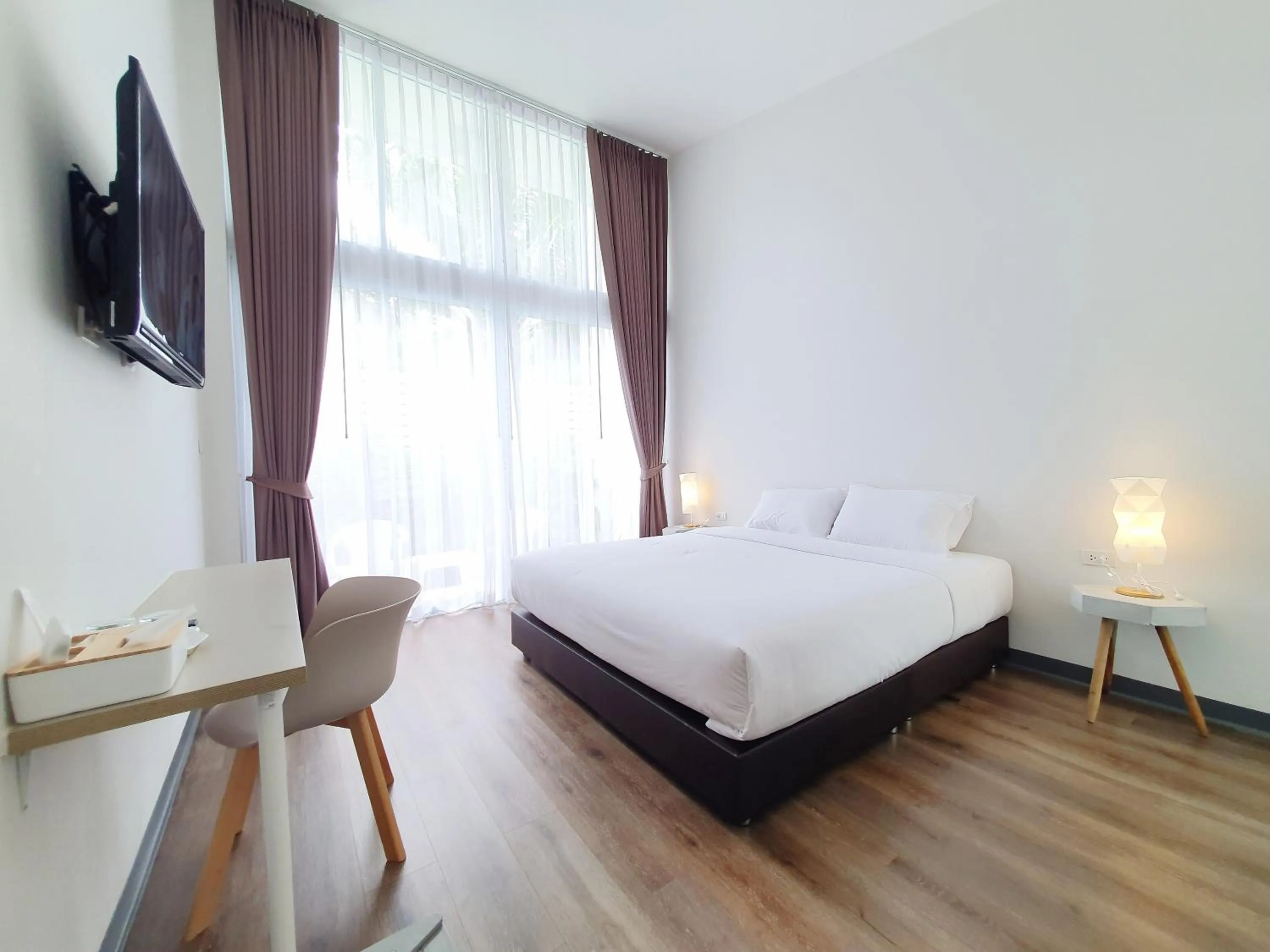 Bed in MEET Boutique Resort