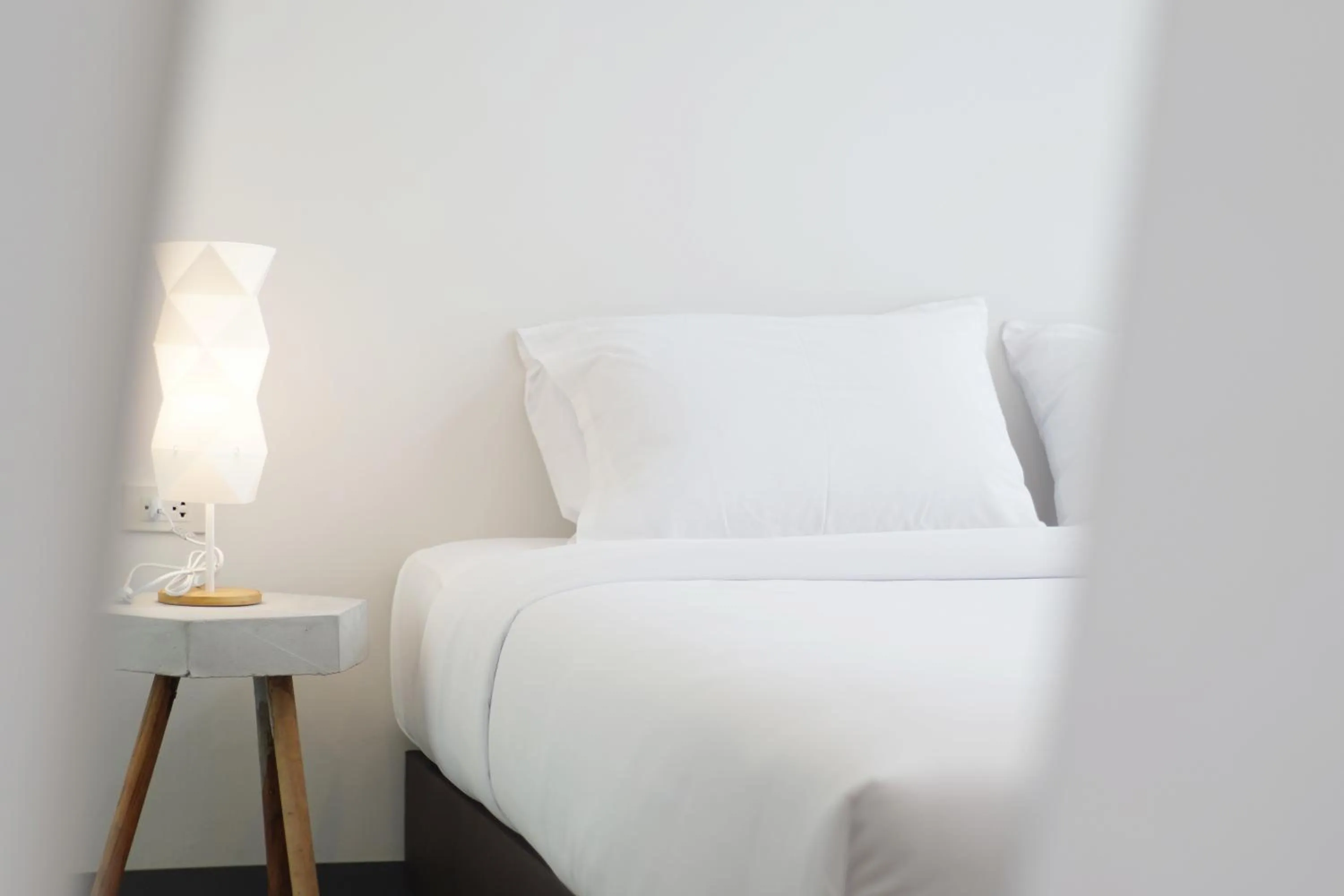 Bed in MEET Boutique Resort