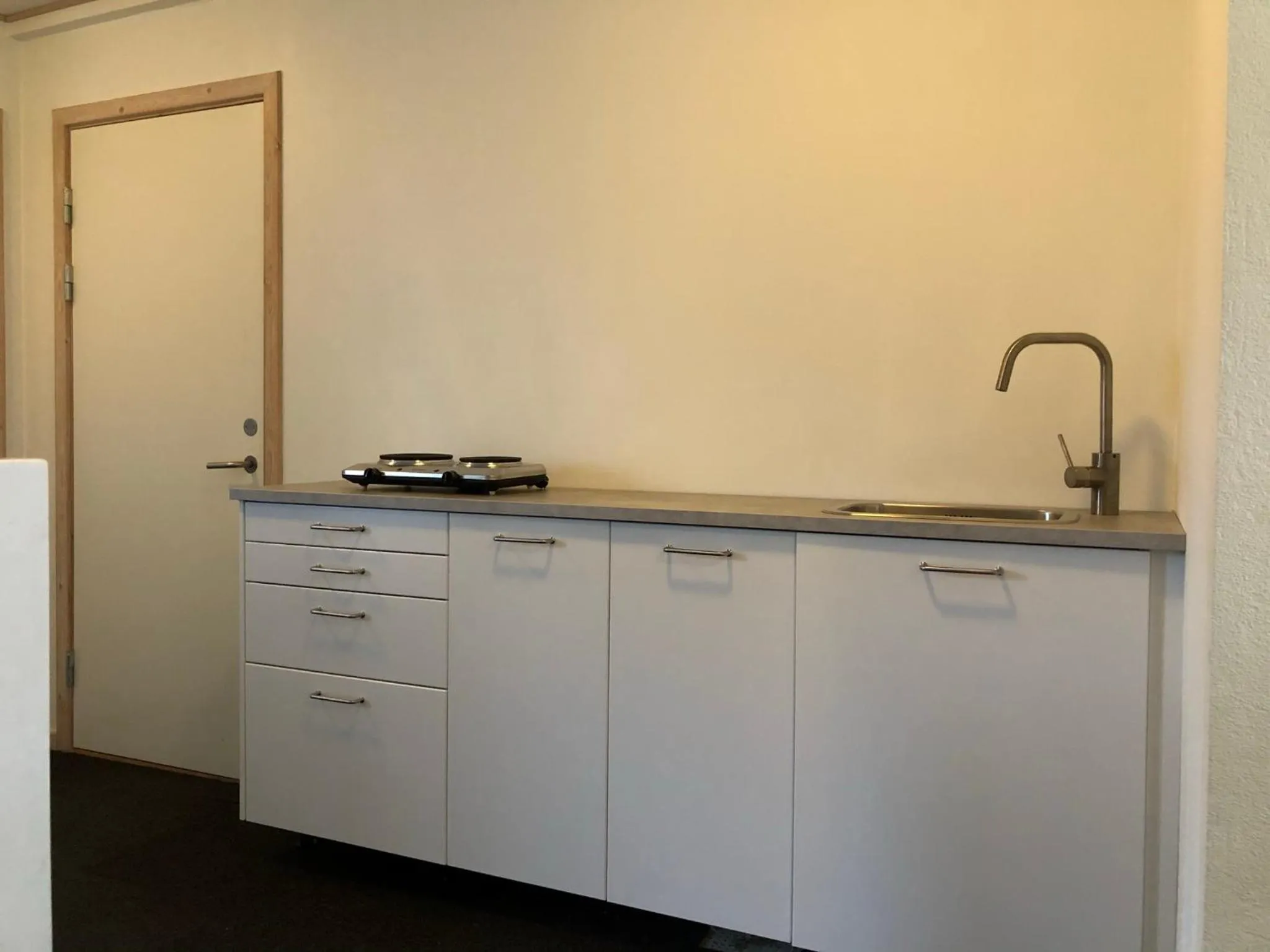 Kitchen or kitchenette in Skjoldbjerg Garnihotel