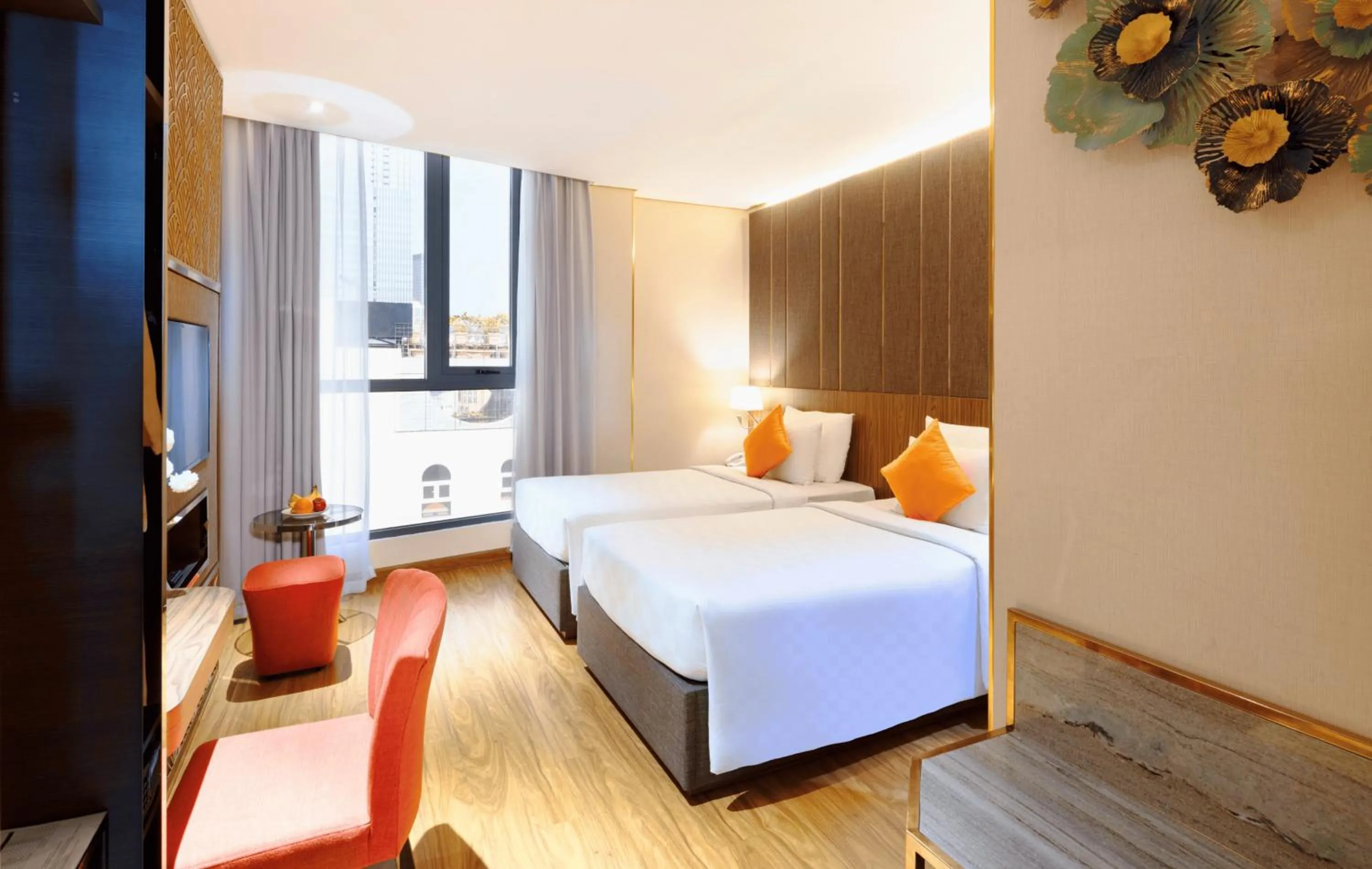 Bed in Winsuites Saigon Hotel