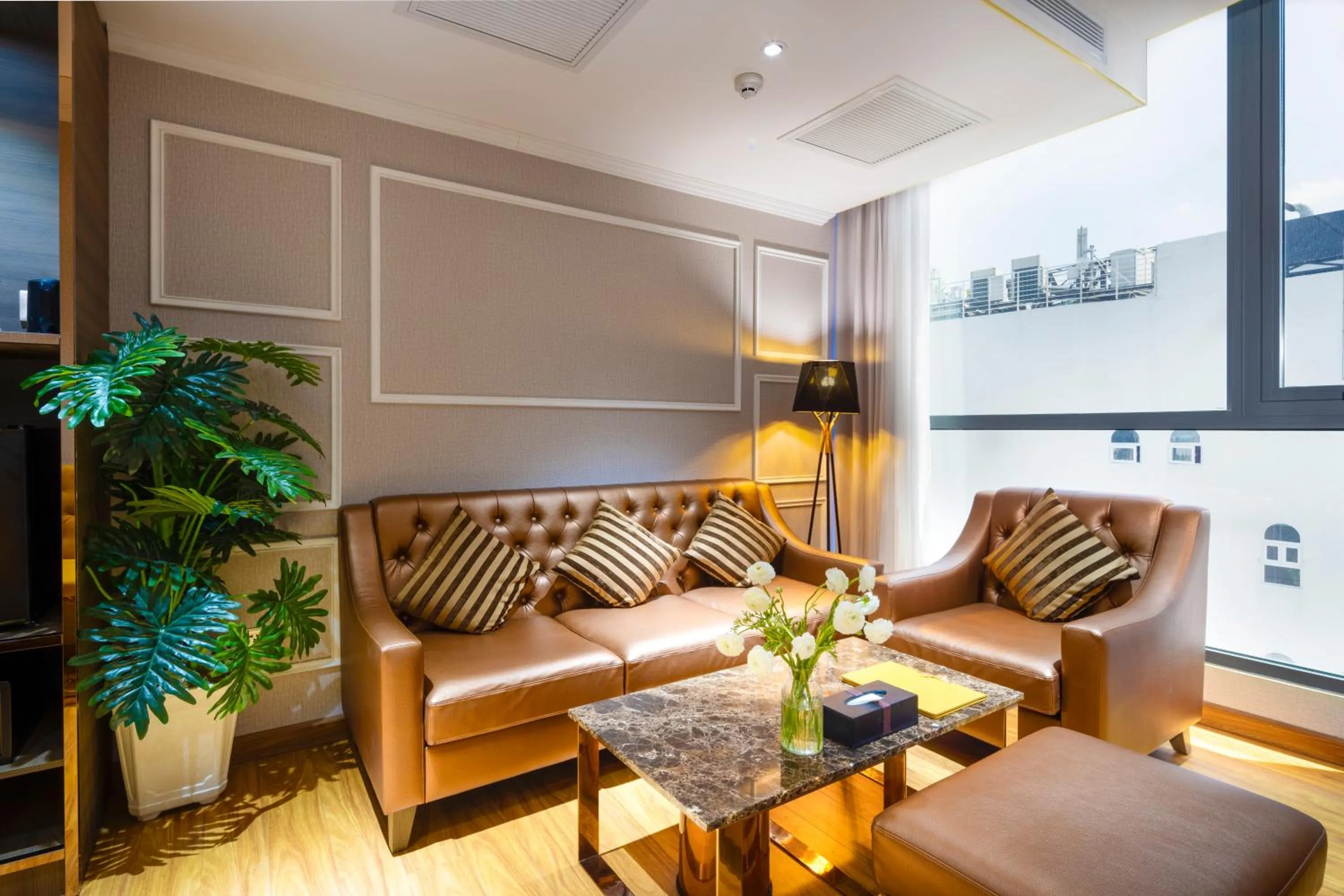 Seating area in Winsuites Saigon Hotel