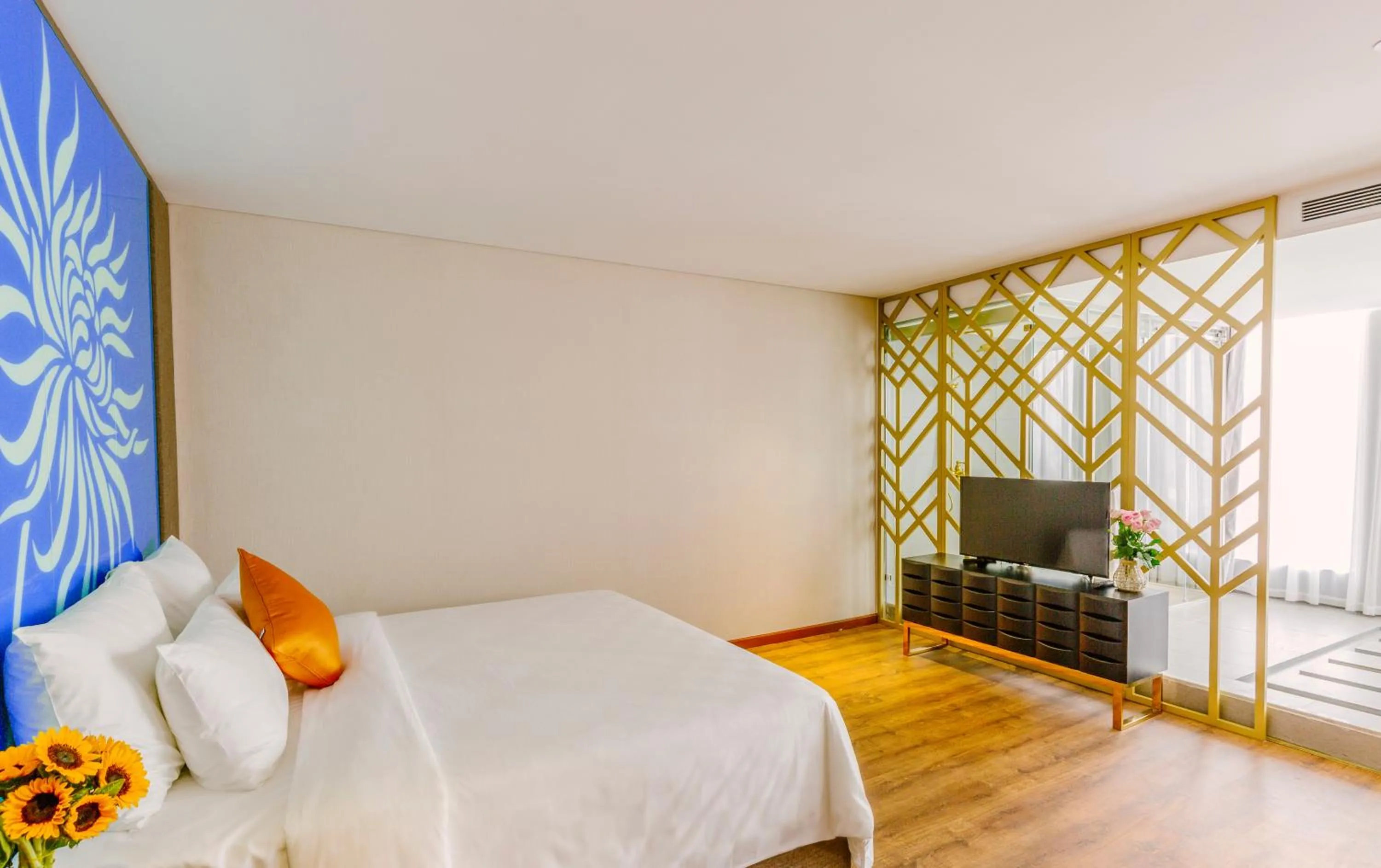 Bed in Winsuites Saigon Hotel