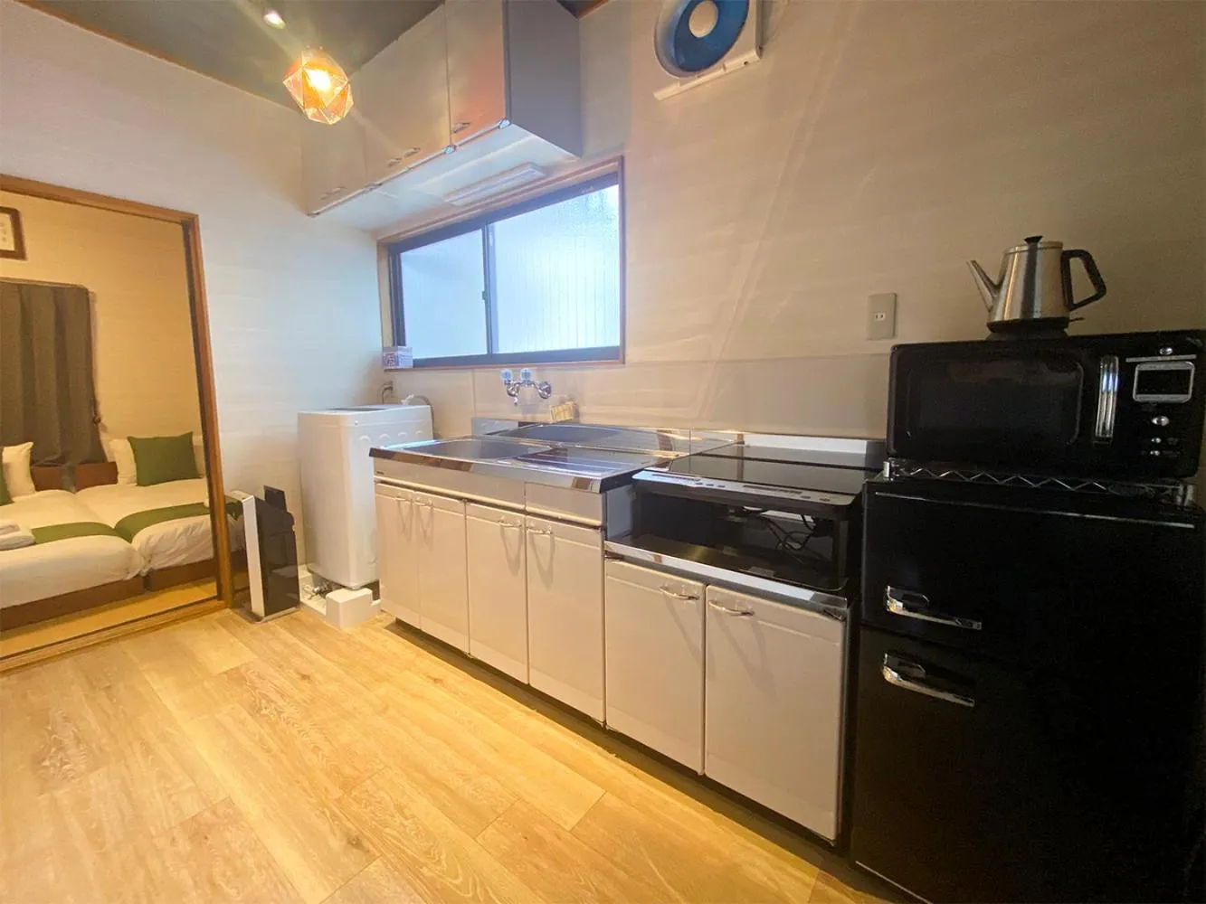 Kitchen or kitchenette, Bed in Kagurazaka Retro BAR & HOTEL