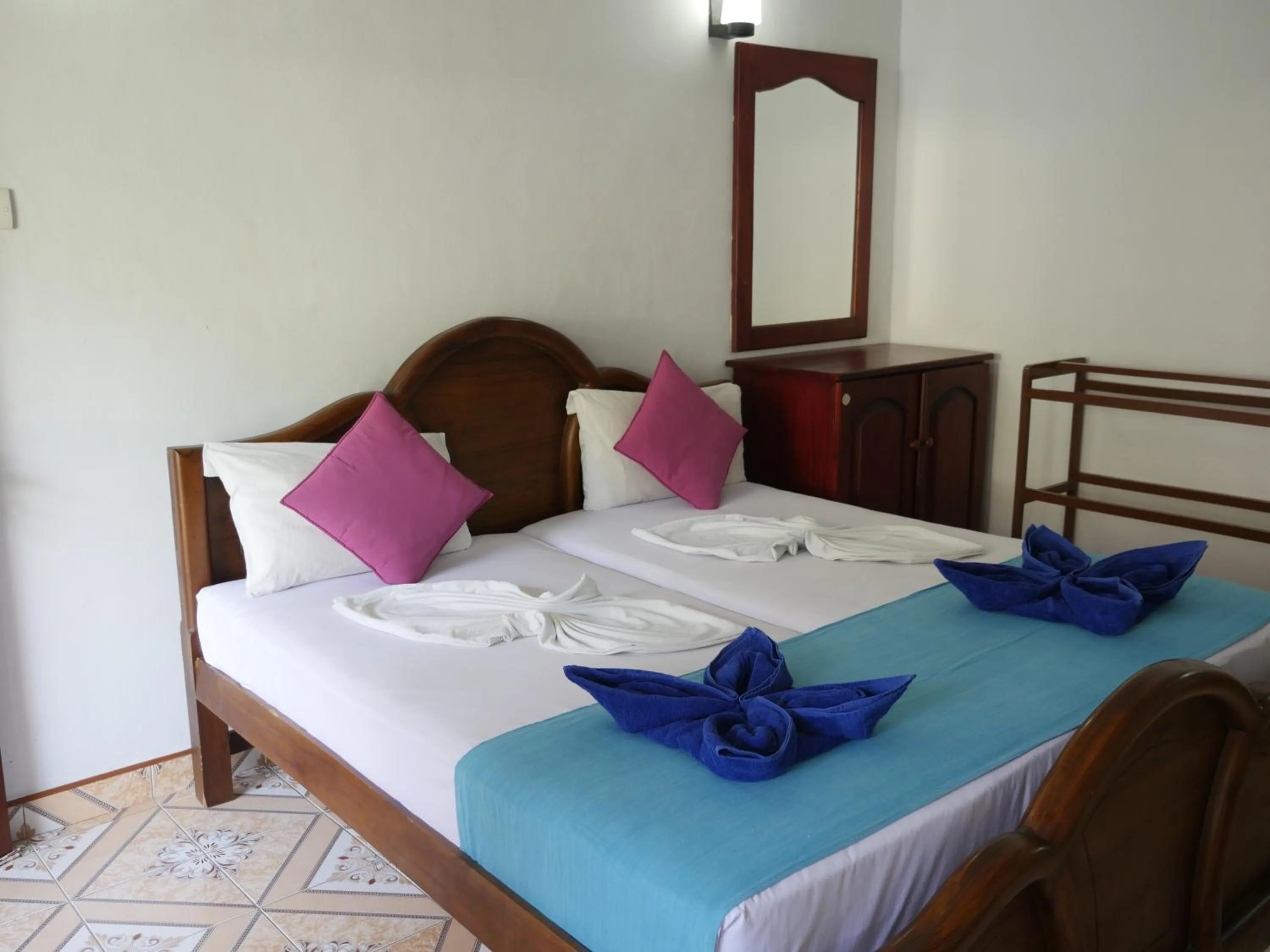 Bed in Ocean View tourist guest house at Negombo beach near the airport