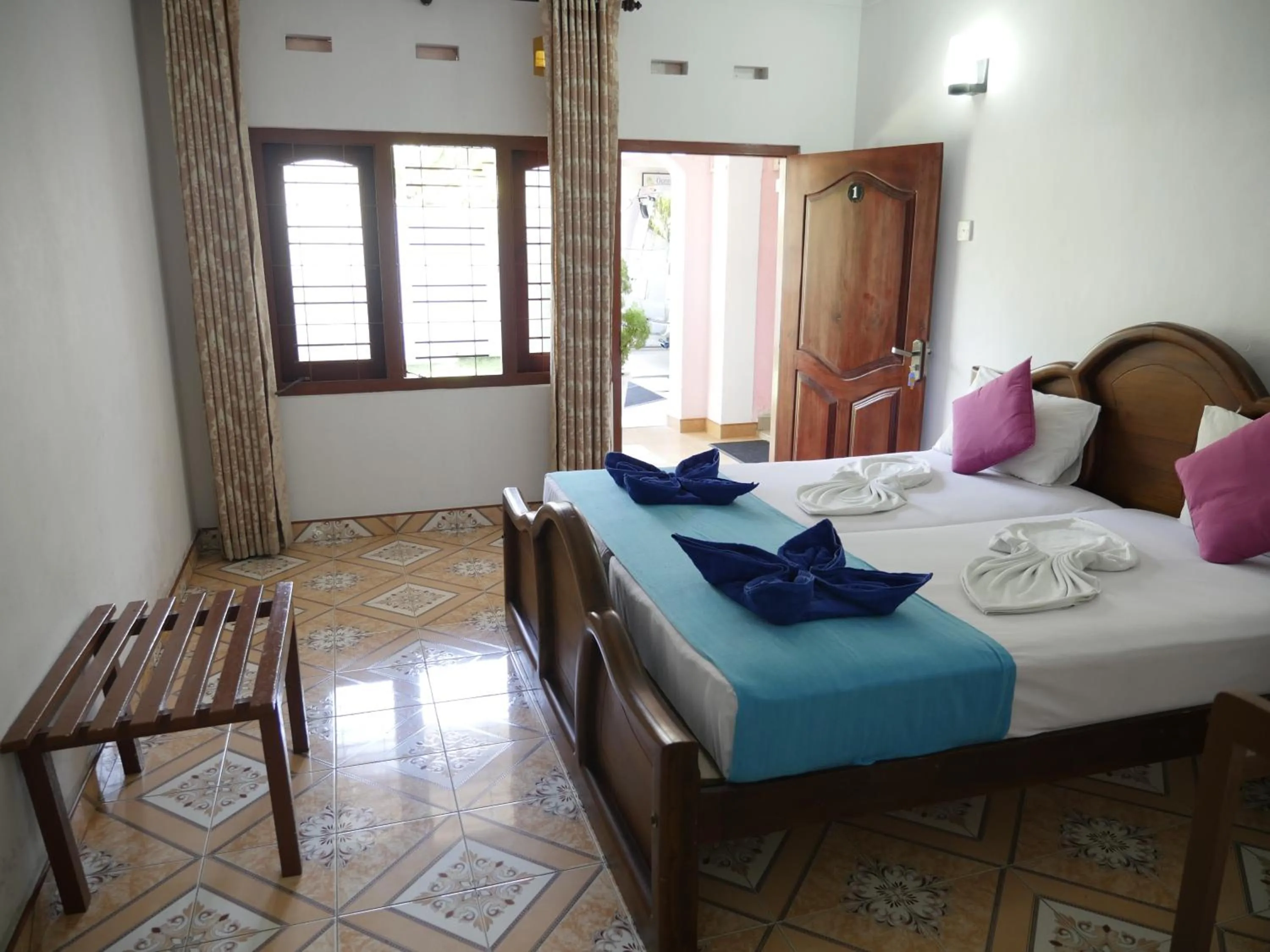 Bed in Ocean View tourist guest house at Negombo beach near the airport