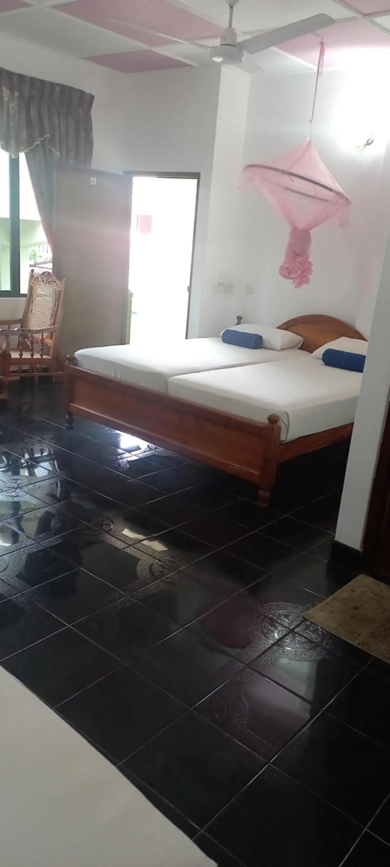 Bed in Ocean View tourist guest house at Negombo beach near the airport