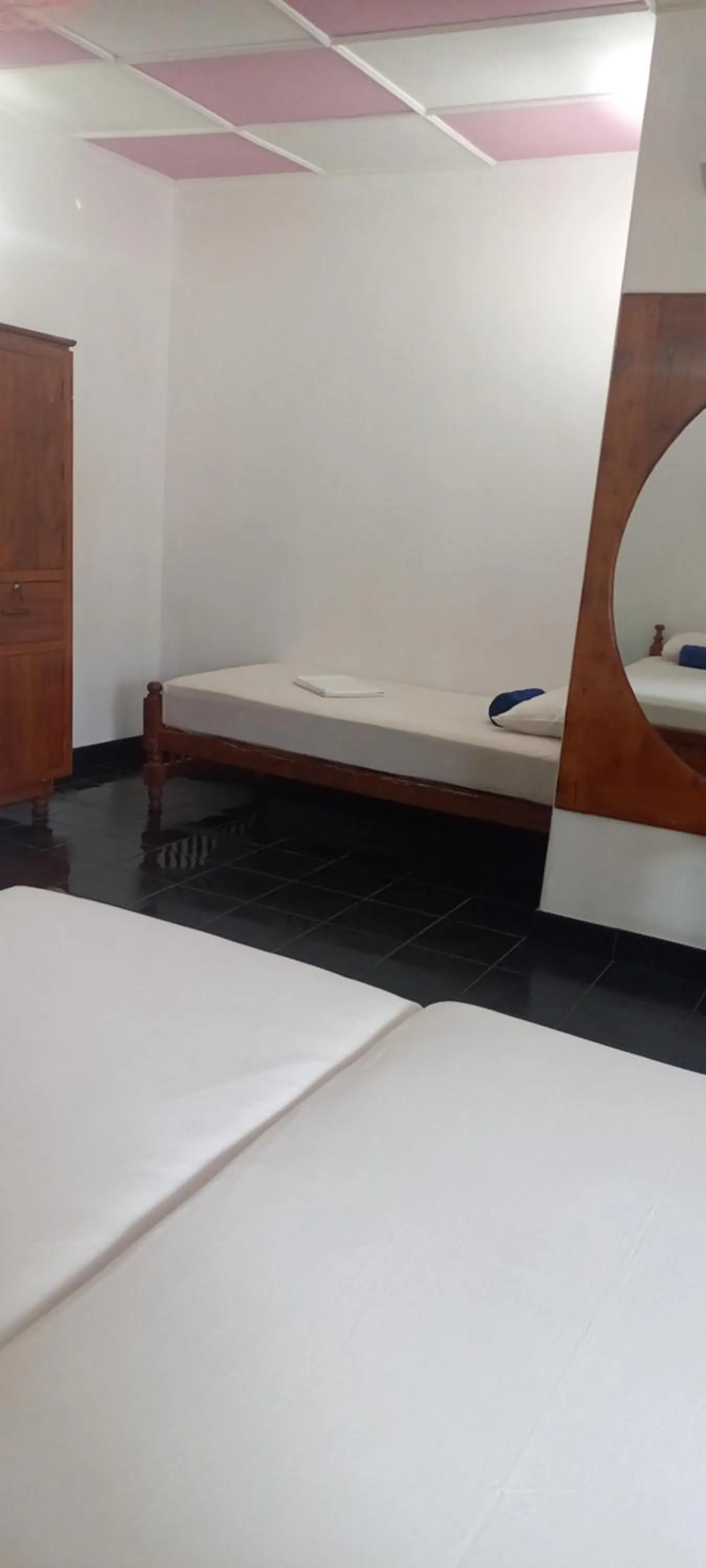 Bed in Ocean View tourist guest house at Negombo beach near the airport