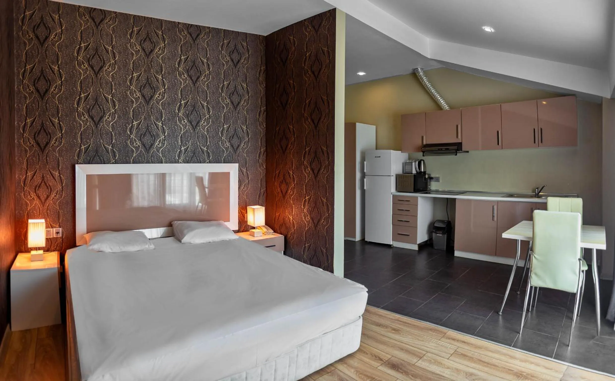 Bed in Diplomat Suites Hotel