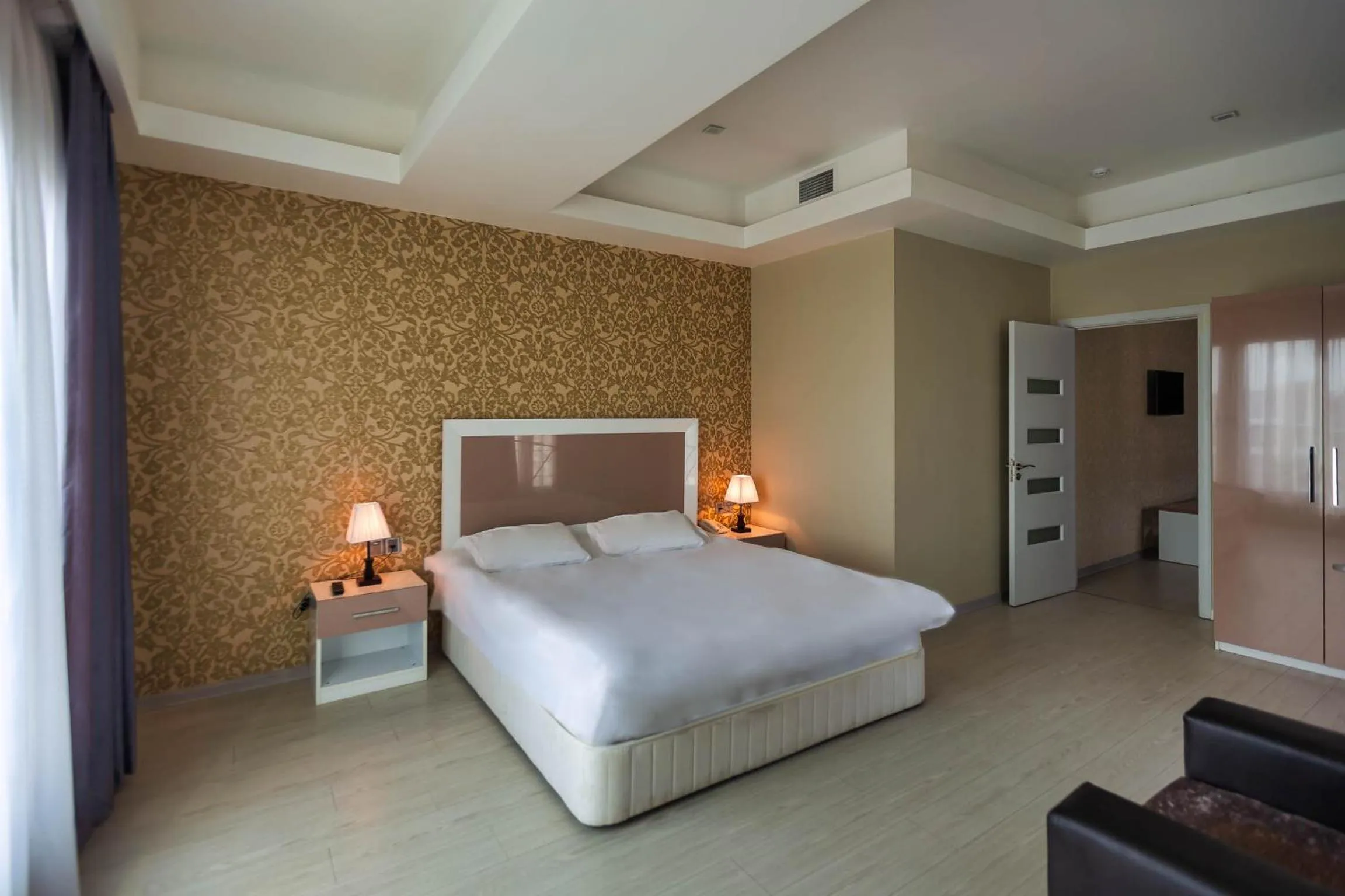 Bed in Diplomat Suites Hotel