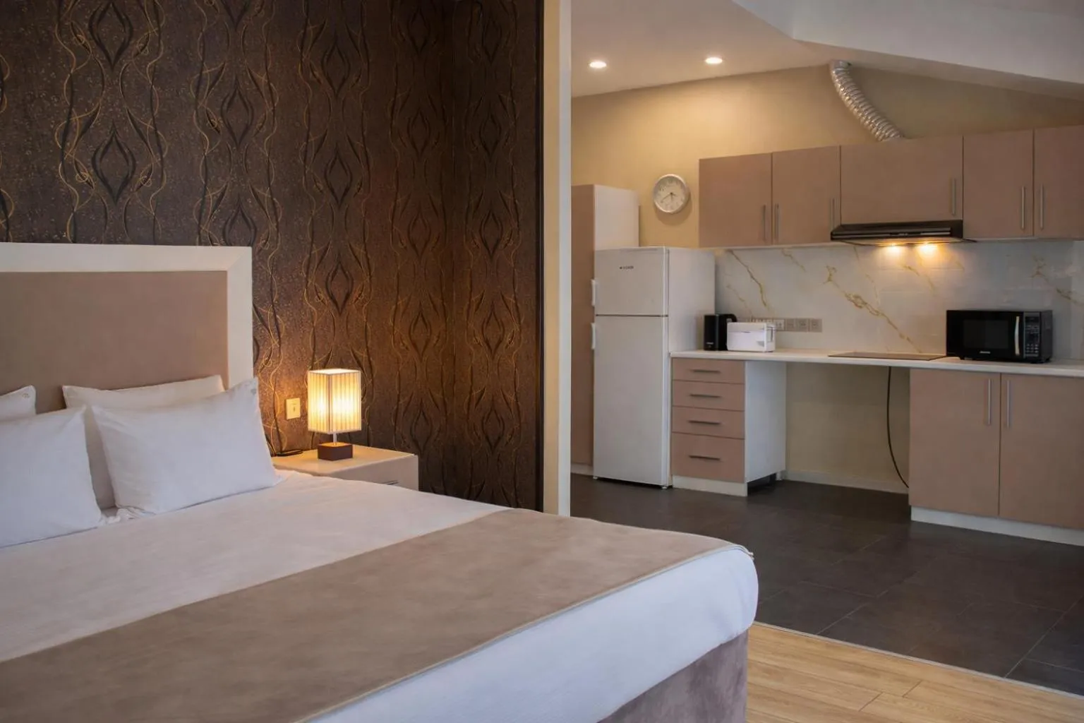 Bed in Diplomat Suites Hotel