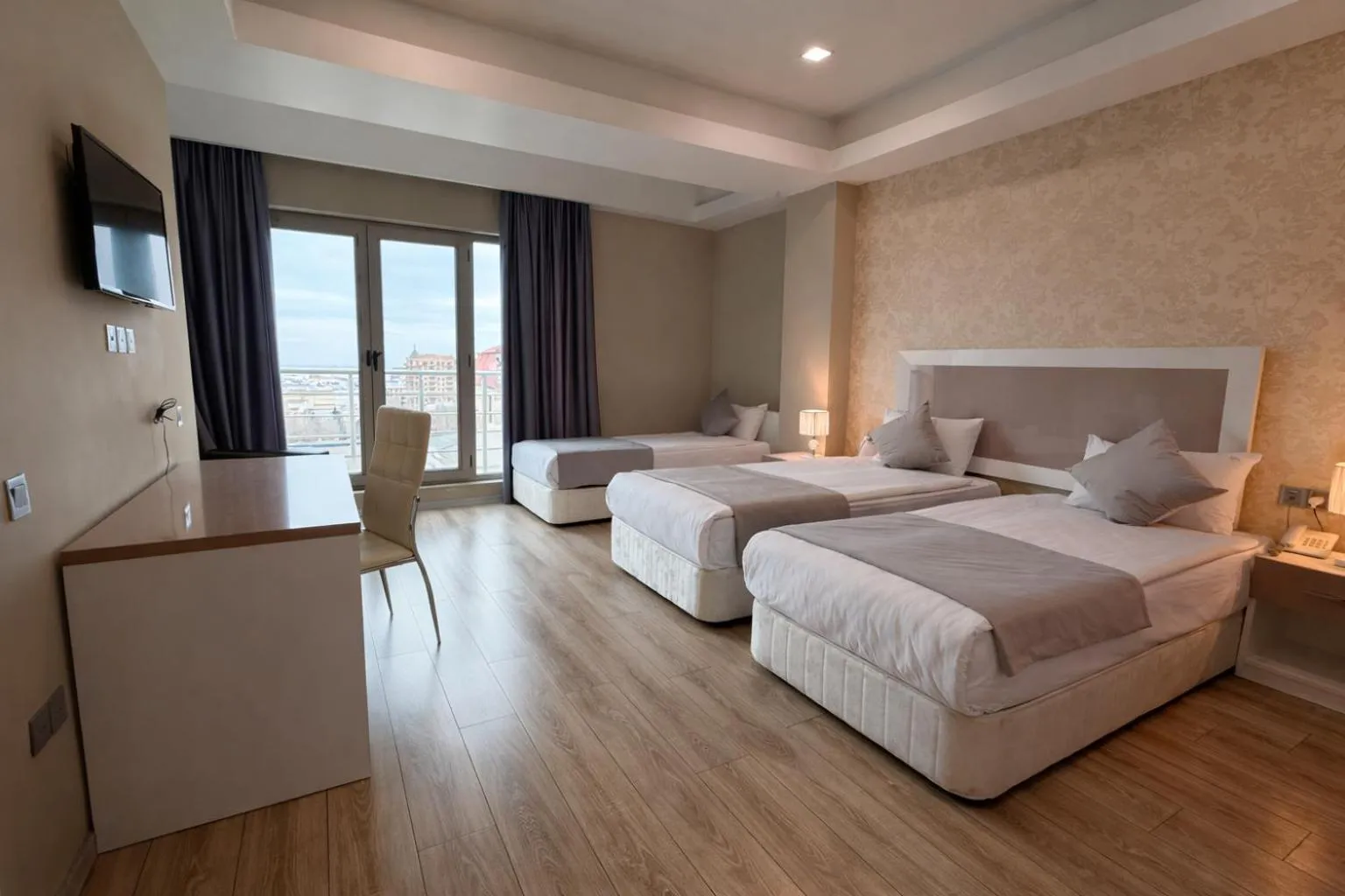Bed in Diplomat Suites Hotel