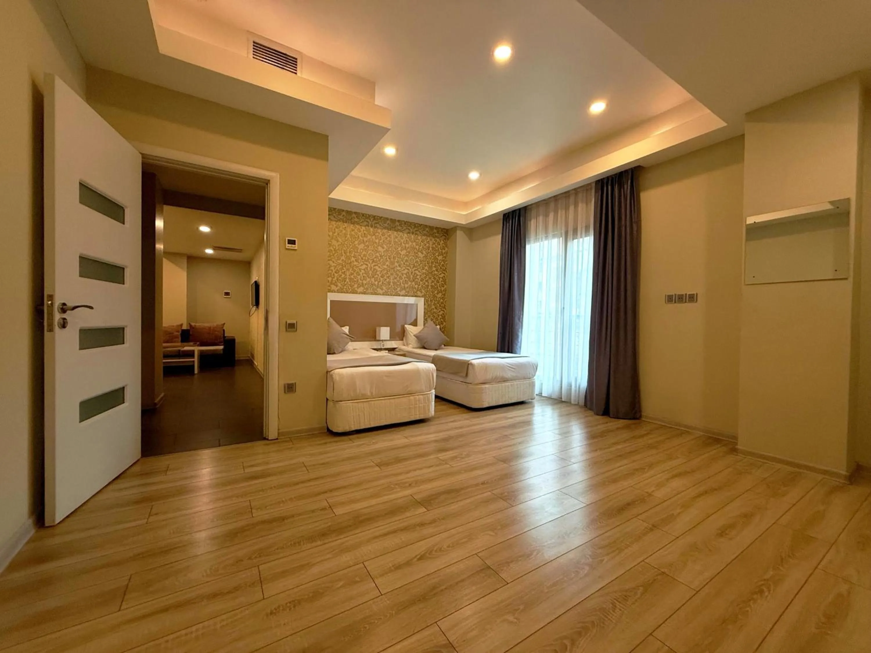 Bed in Diplomat Suites Hotel