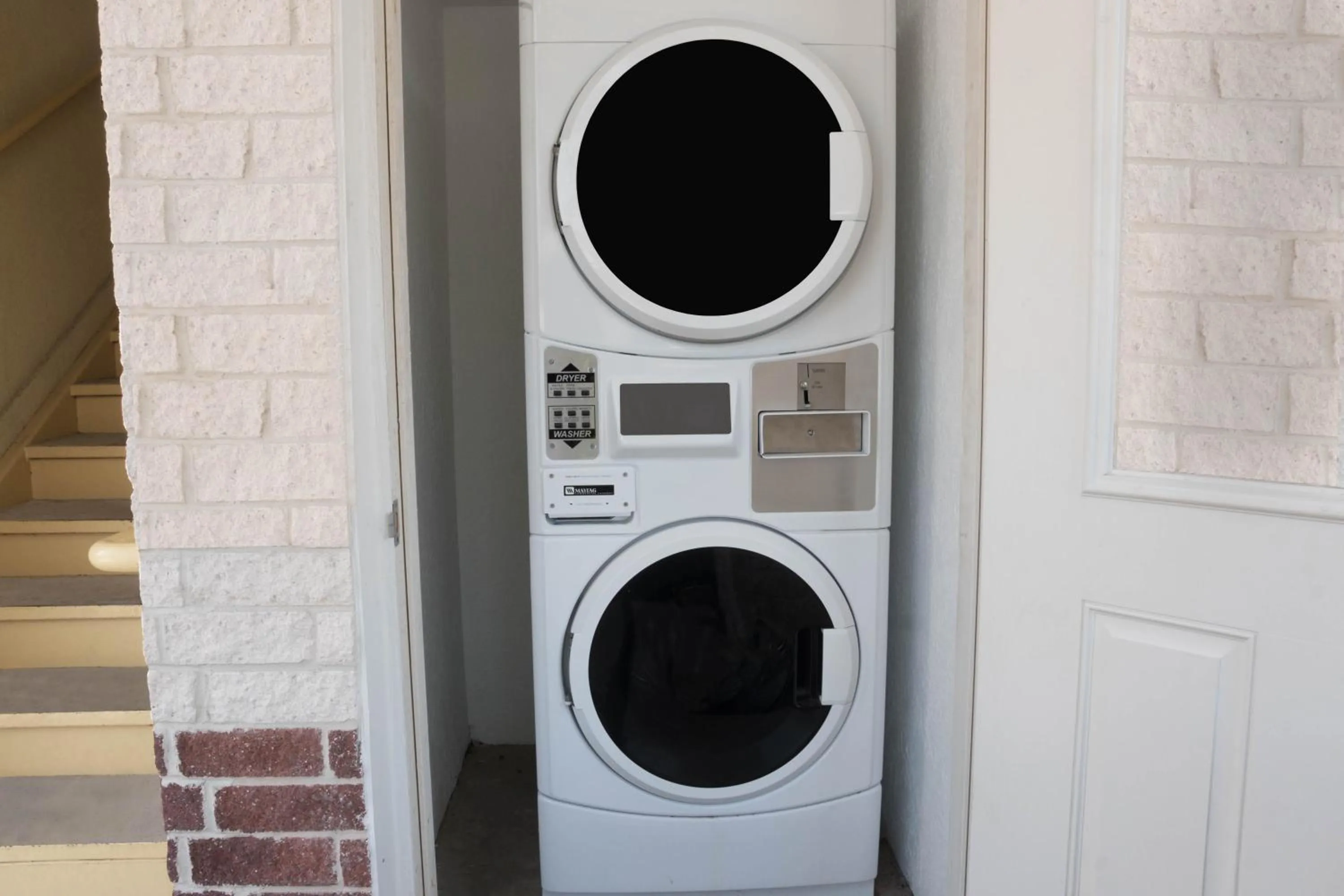 washing machine in Super 8 by Wyndham Rosenberg TX