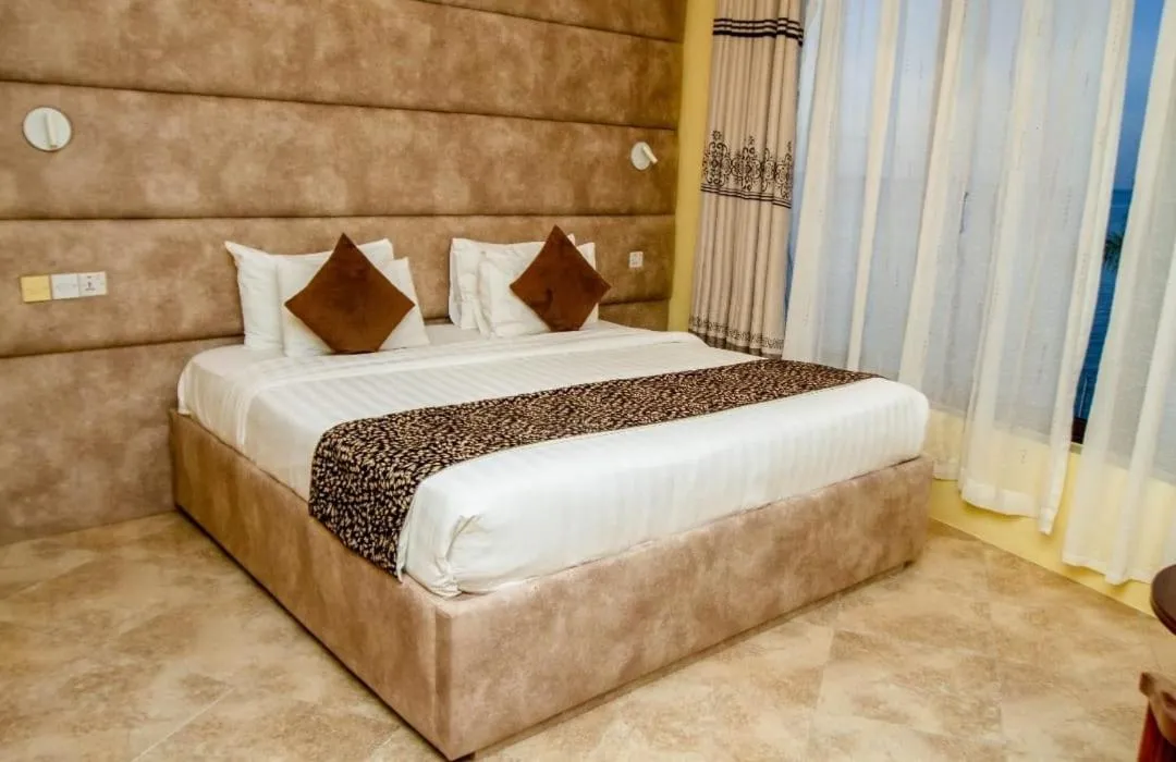 Bed in Malaika Beach Resort