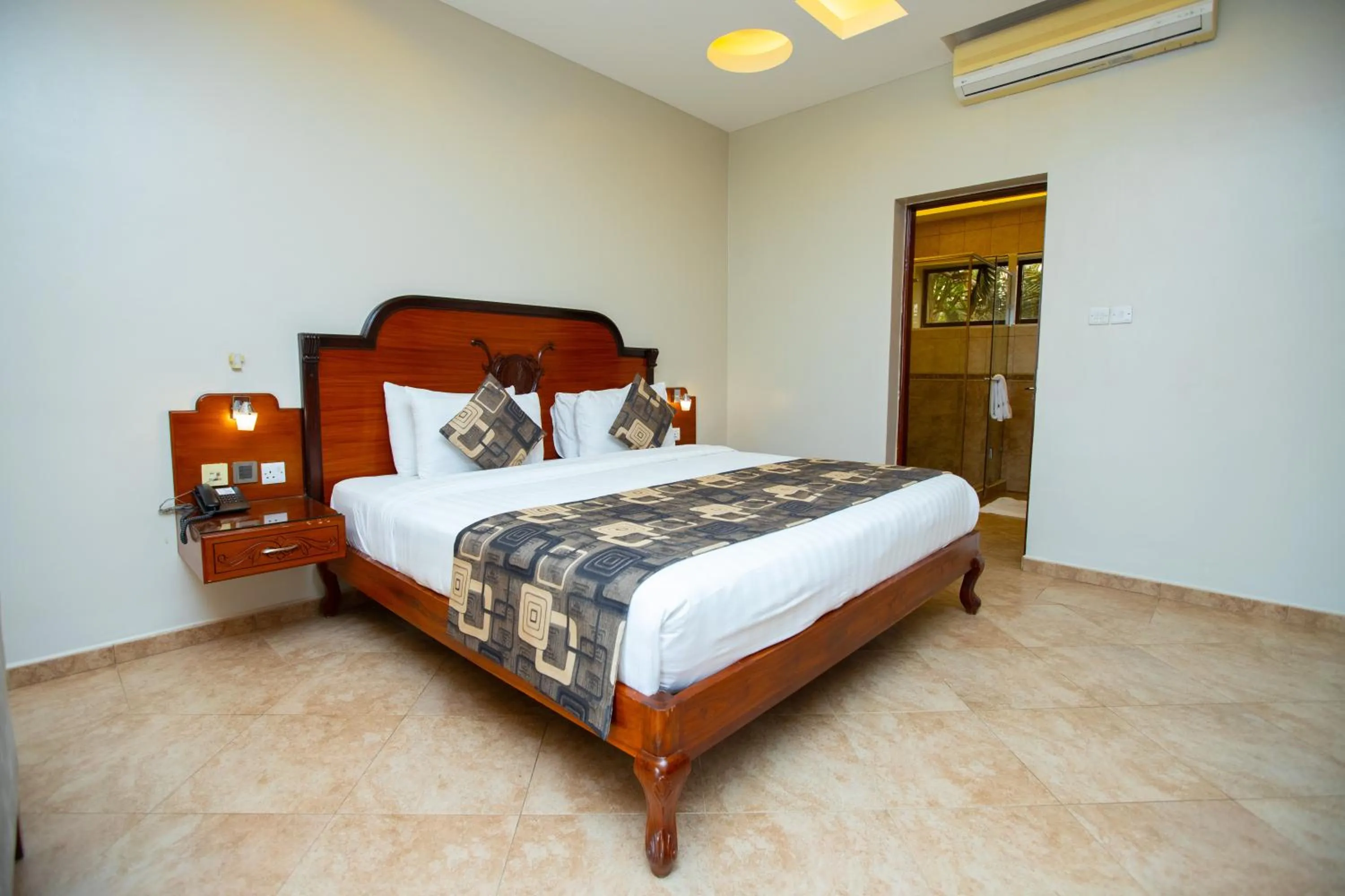 Bed in Malaika Beach Resort